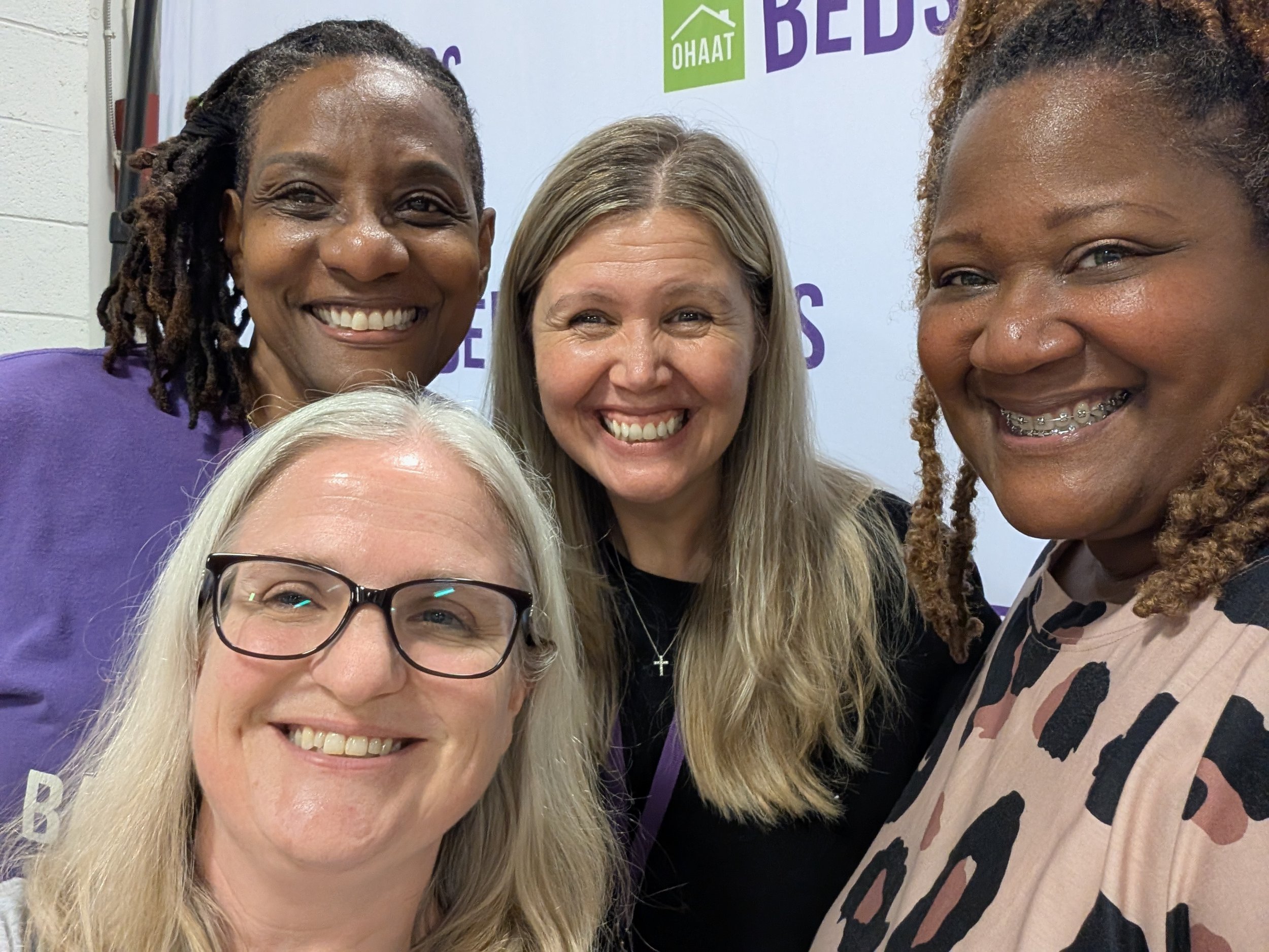Volunteer Tamika (right) with staff