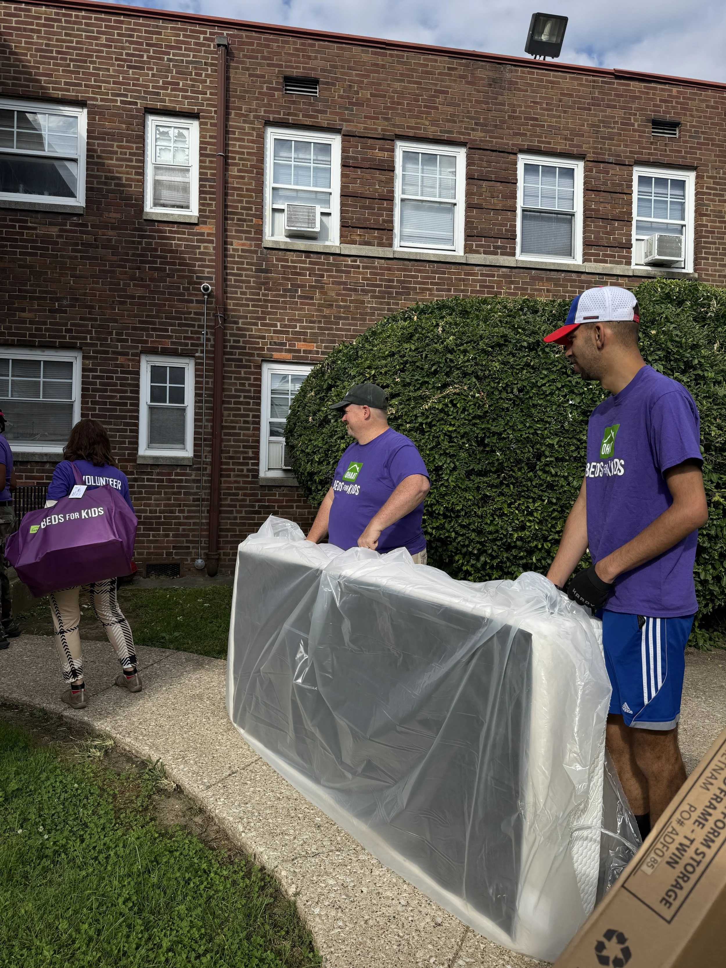 Pattie, Warren & Dave - Delivery team preparing to enter home.JPG