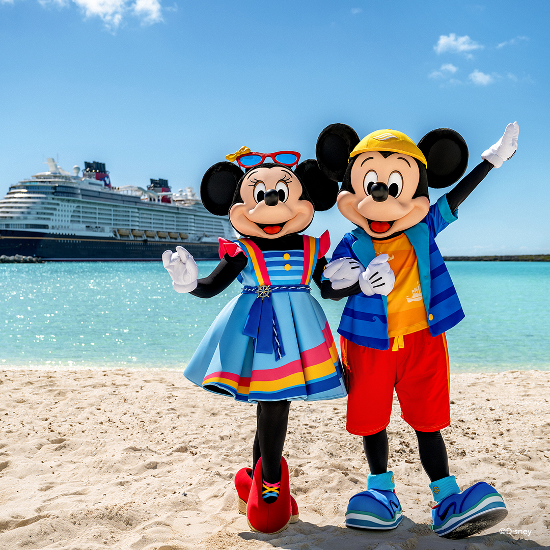 Minnie Mouse and Mickey Mouse dressed in colorful beach clothing, standing on a sandy beach with a cruise ship in the background.