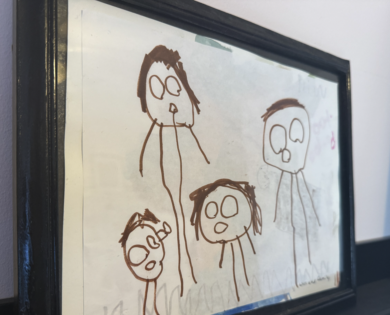 Drawing of four stick figures