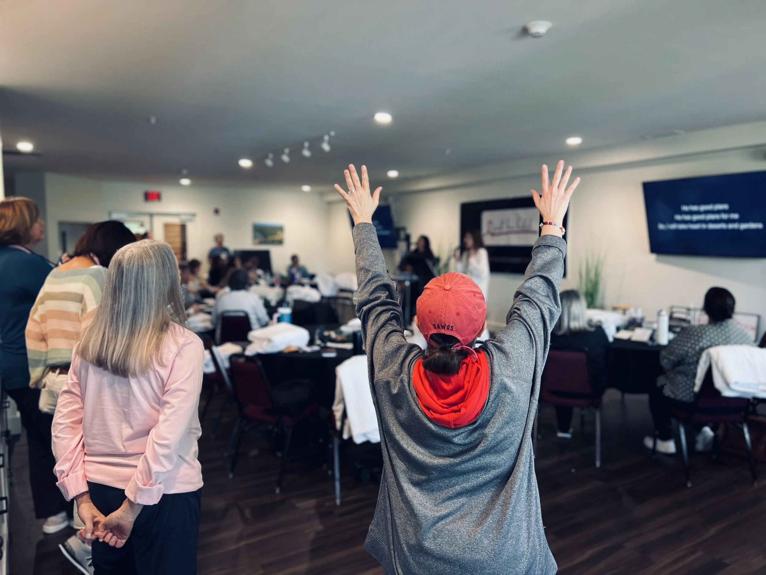 Women worshipping at a Just Be Held retreat