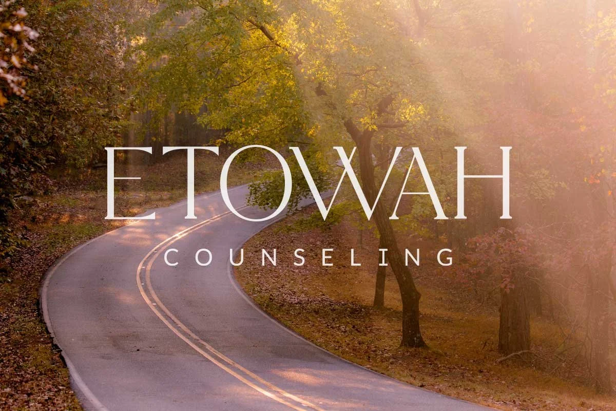 A winding country road through a forest with trees and autumn foliage, with sunlight filtering through the trees, and the words 'Etowah Counseling' overlaid.