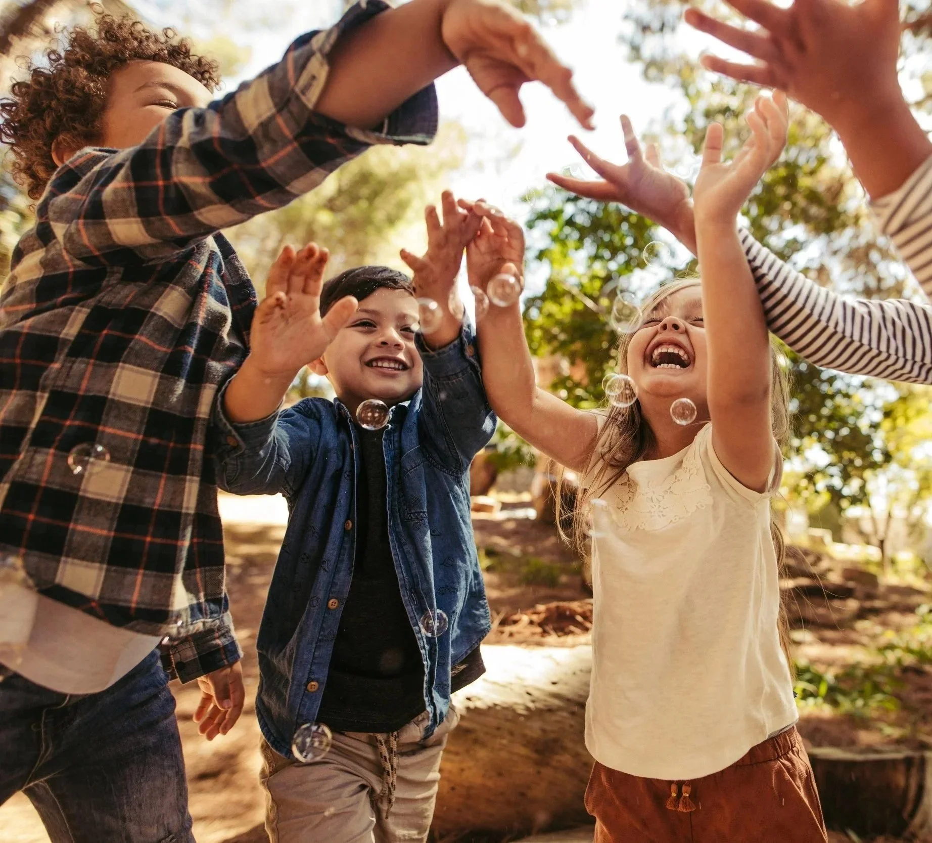 Chrildren playing blowing bubbles