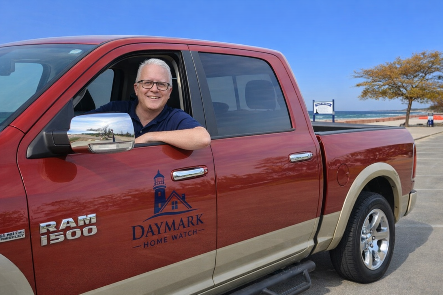 Jim Casler, sitting in pickup truck with Daymark Home Watch logo, at Stearns Park in Ludington, Michigan.
