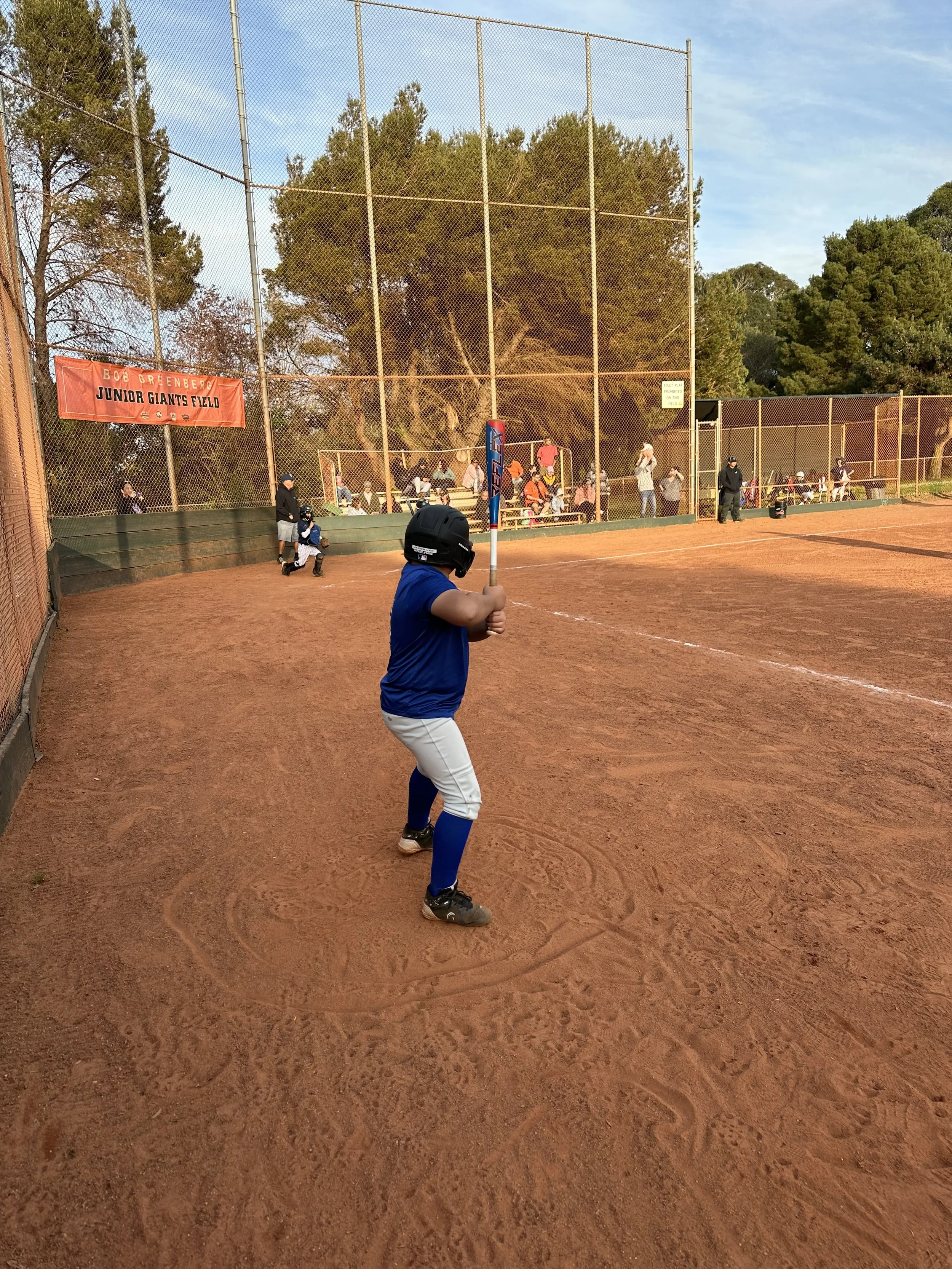 Young boy plays baseball ready to hit a home run. Focused and determined.