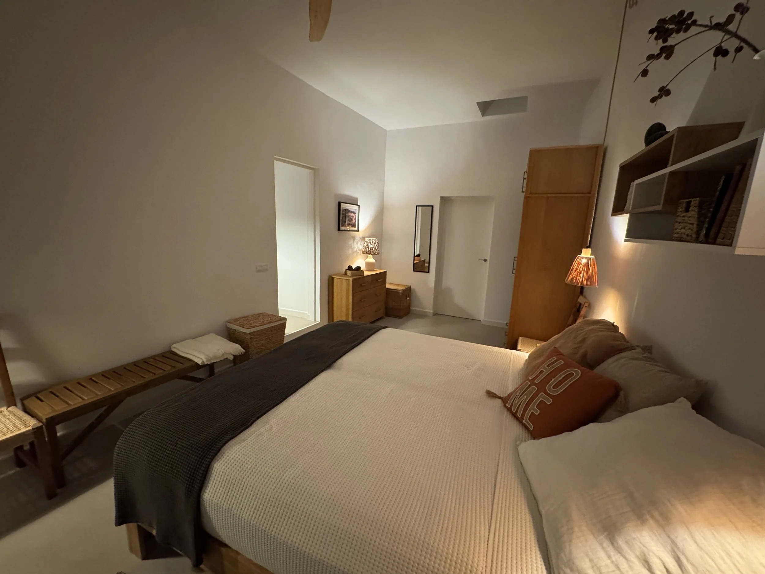 Boutique bedroom with natural wood details at Casita Luna Lanzarote