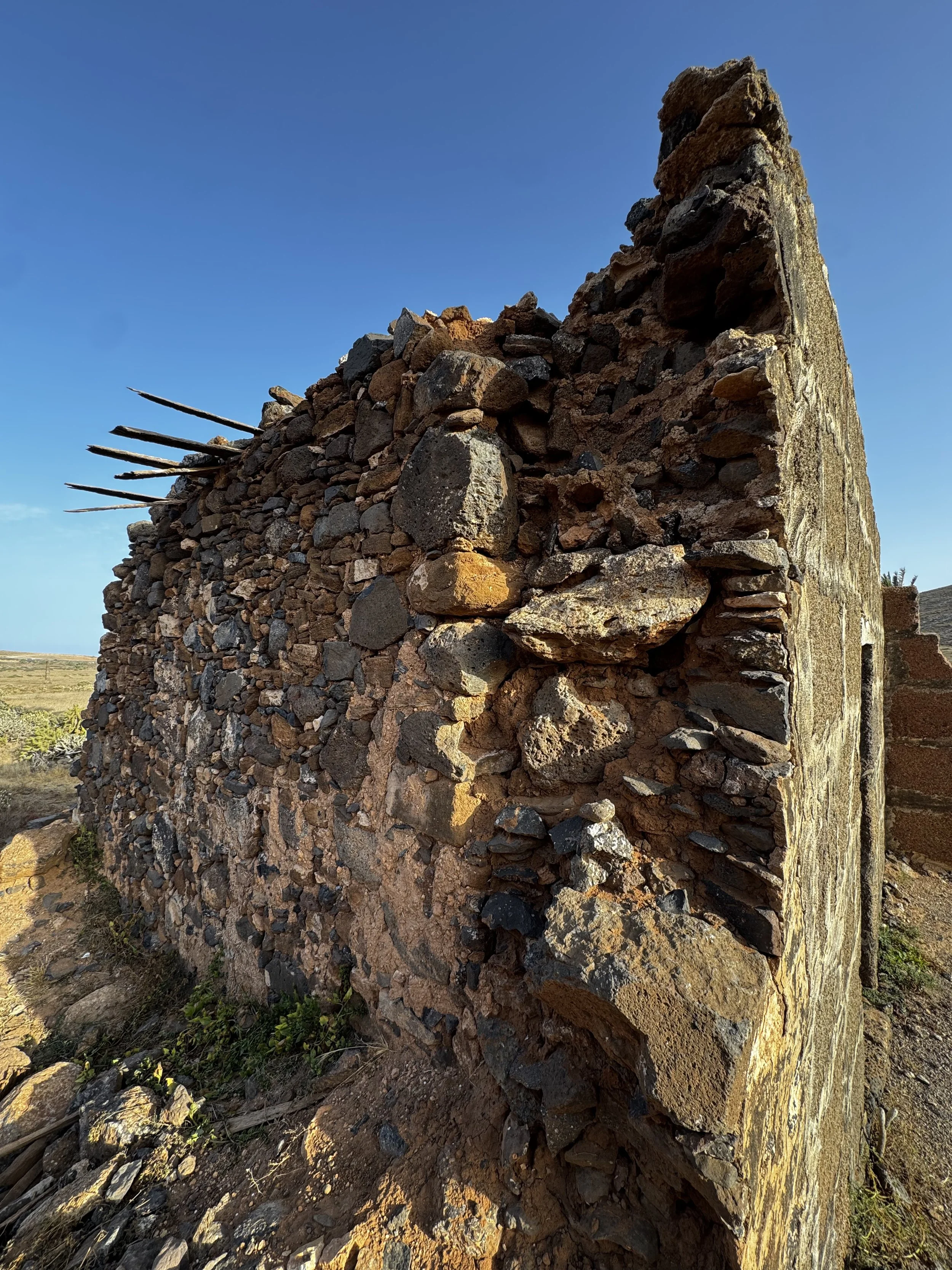Volcanic stone walls of a traditional Lanzarote farmhouse.