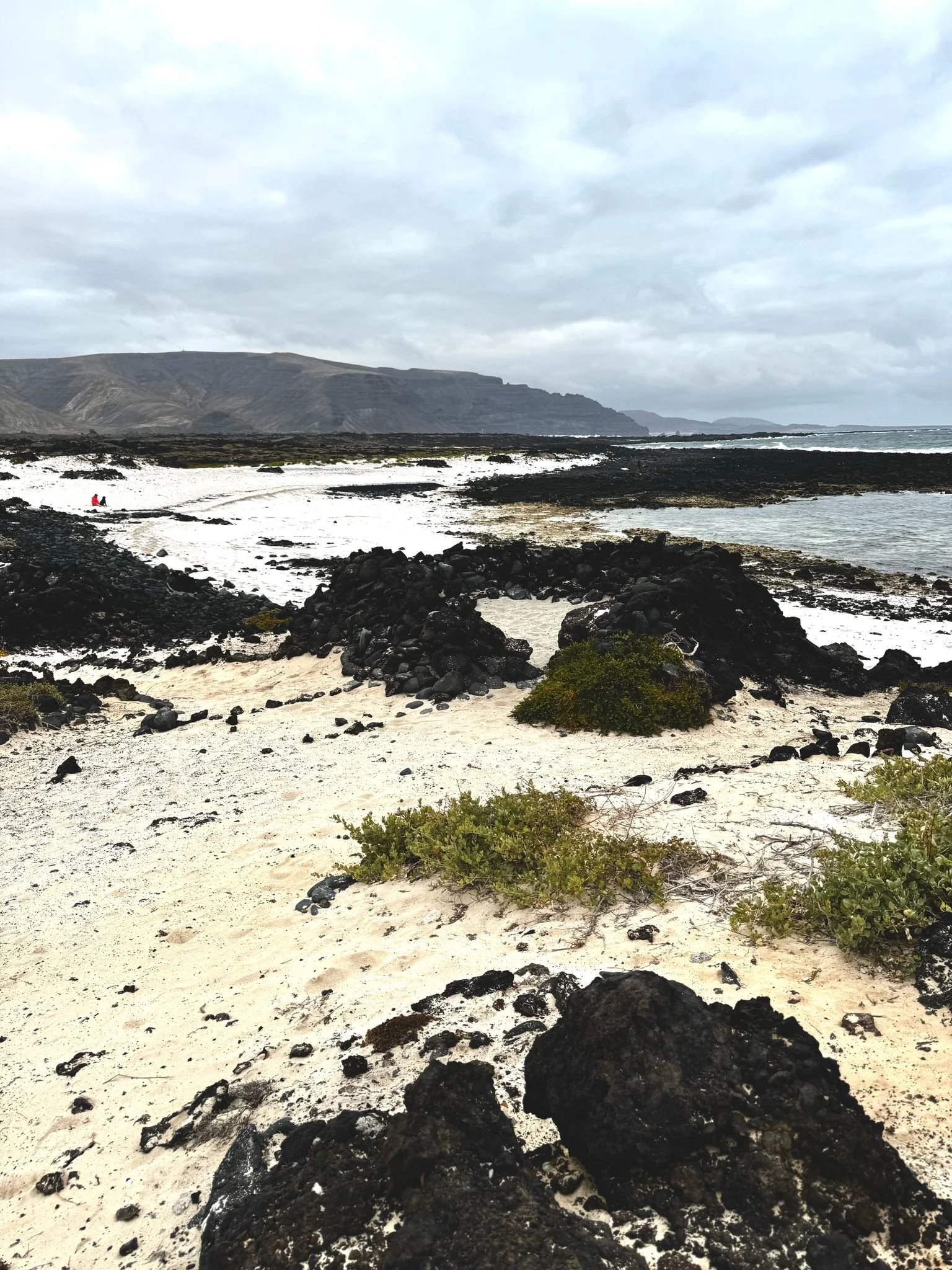Hidden beach between volcanic rocks in northern Lanzarote