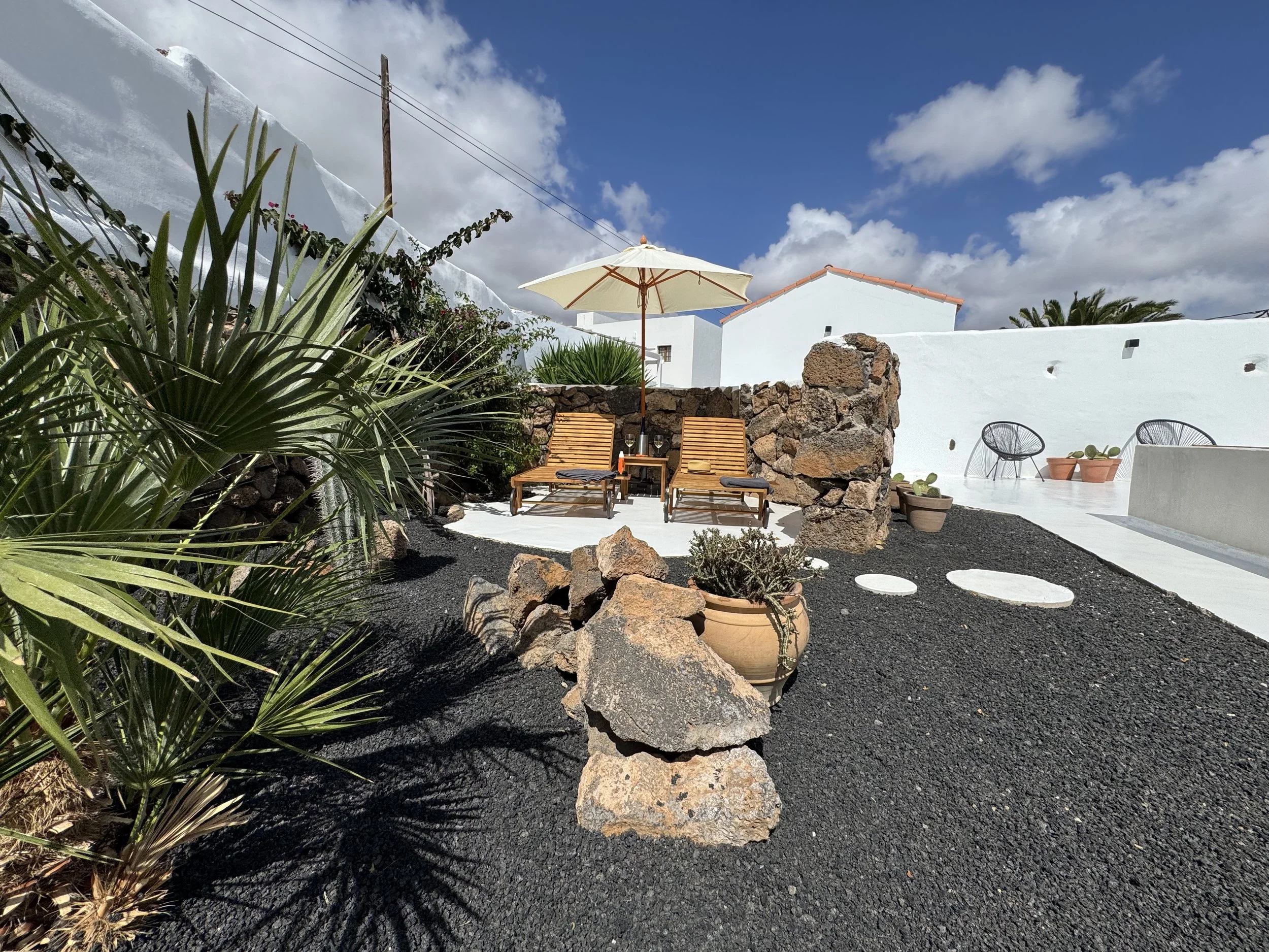 Private pool retreat surrounded by lava stone gardens in Lanzarote