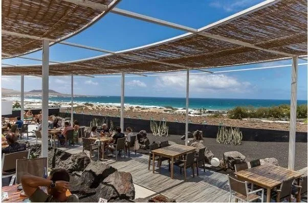 Sunny outdoor terrace overlooking the Atlantic Ocean at Famara, Lanzarote