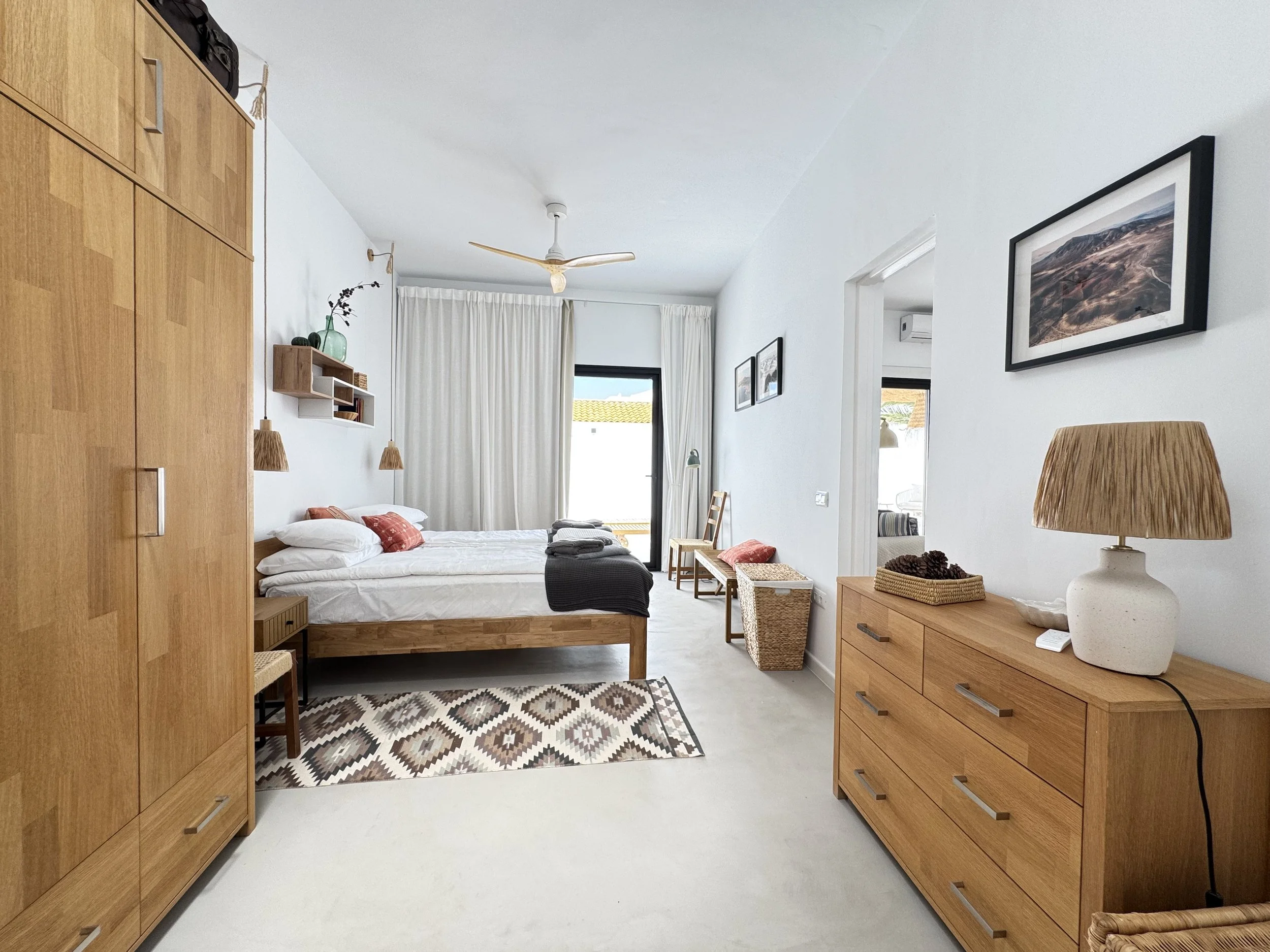 Spacious bedroom with dresser and boutique styling at Casita Luna Lanzarote