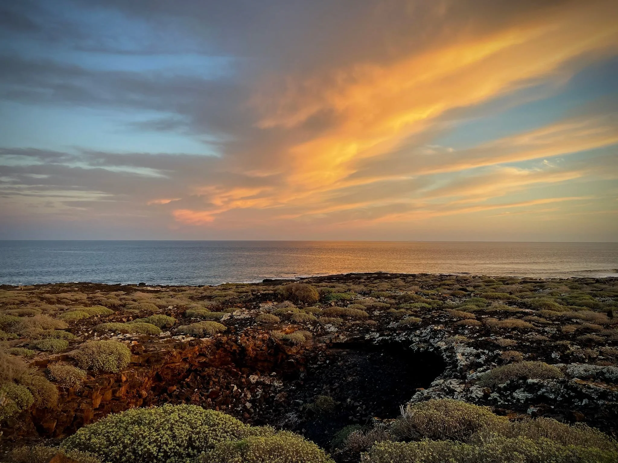 Sunset over the volcanic coastline of north Lanzarote
