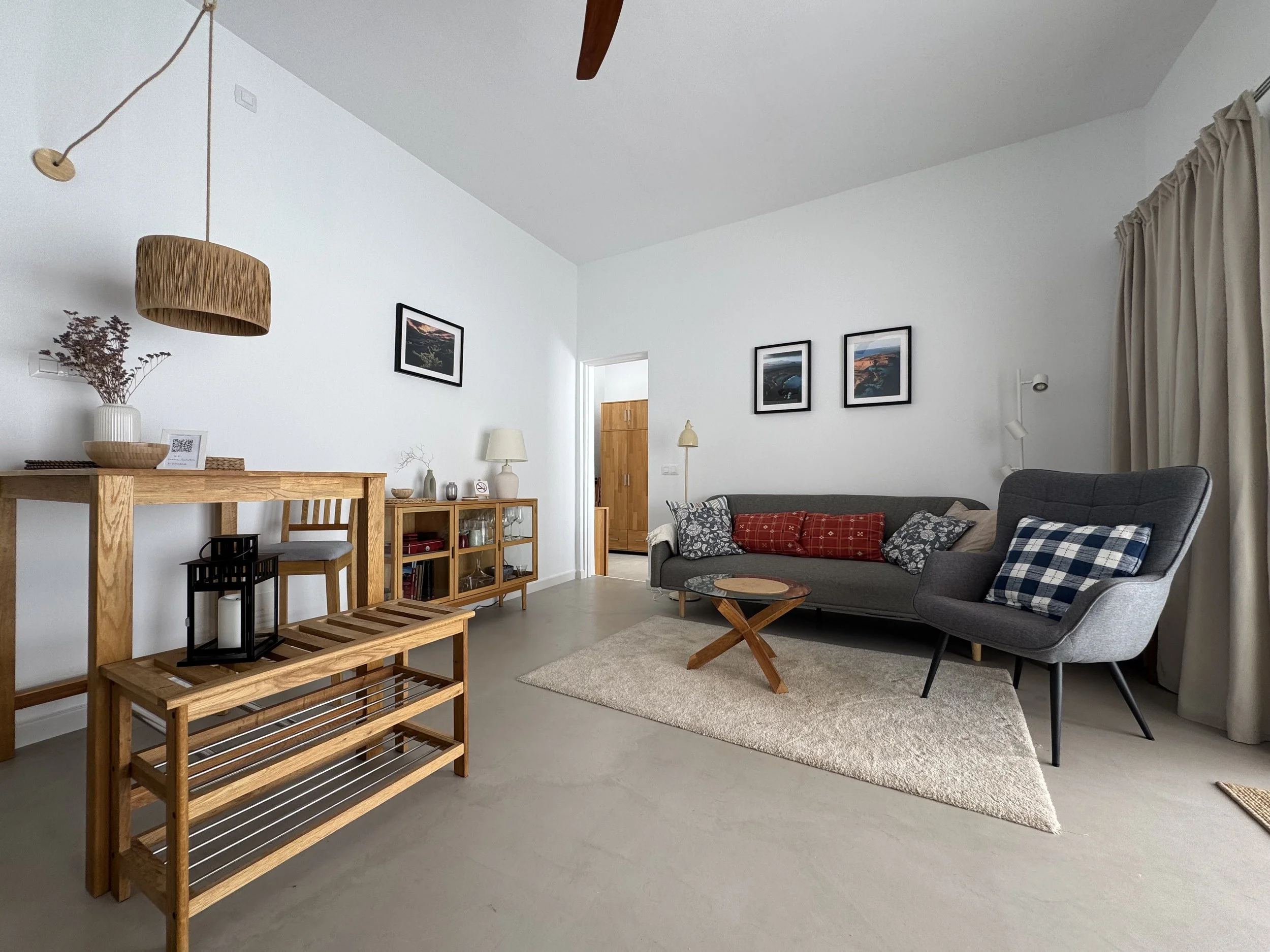 Cozy living room corner with natural wood furniture at Casita Luna Lanzarote