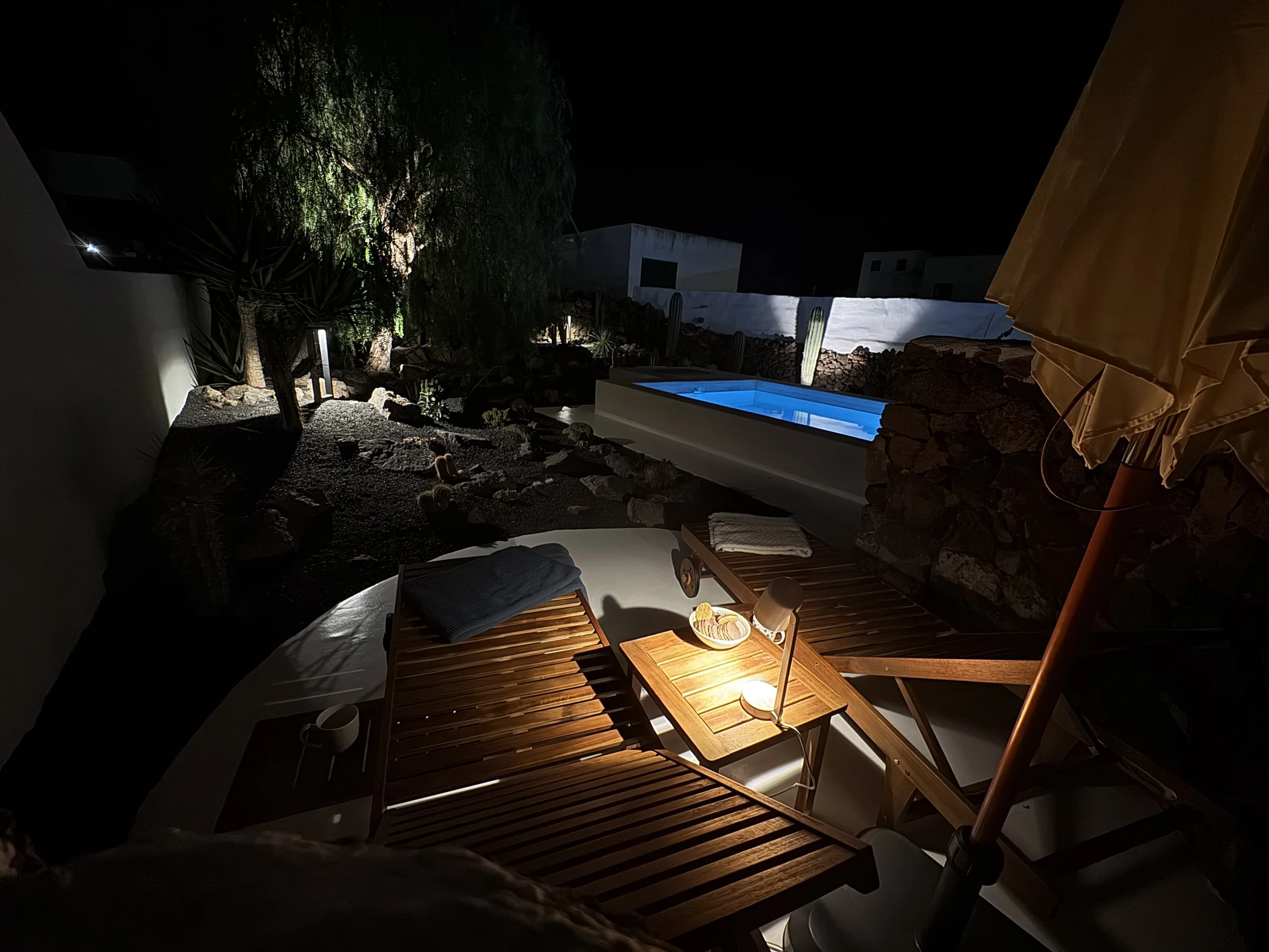 Slow living atmosphere around the illuminated pool at Casitas Santa Rita Lanzarote