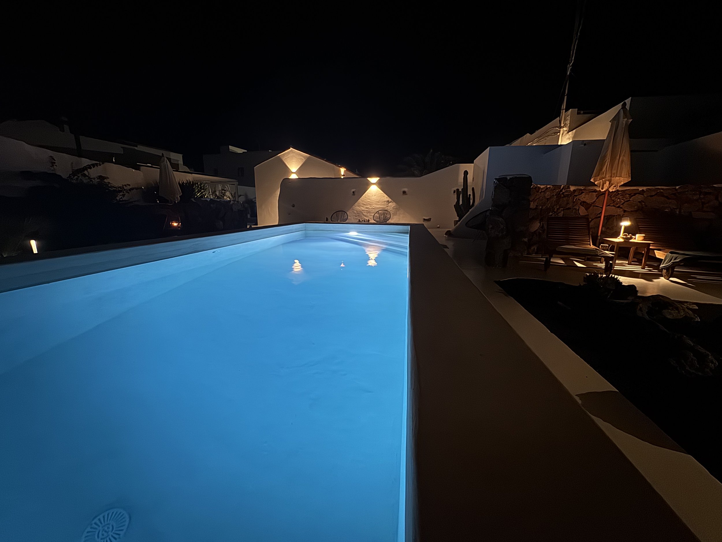 Illuminated swimming pool at night at Casitas Santa Rita Lanzarote