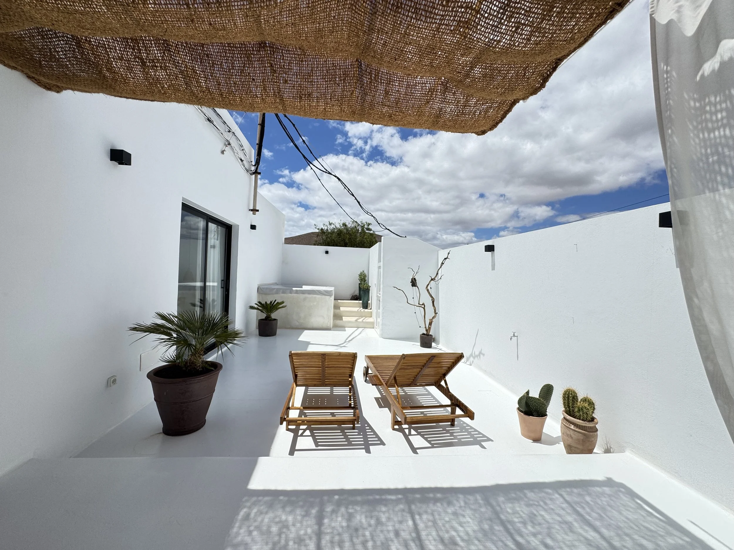 Boutique accommodation in northern Lanzarote featuring a private terrace, exclusive outdoor jacuzzi, natural design and a peaceful slow living atmosphere away from the crowds.