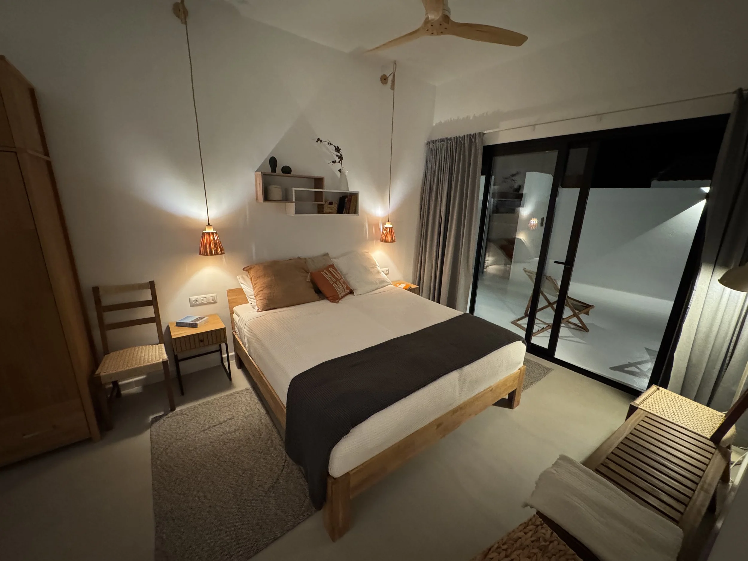 Cozy bedroom with warm evening lighting at Casita Luna Lanzarote