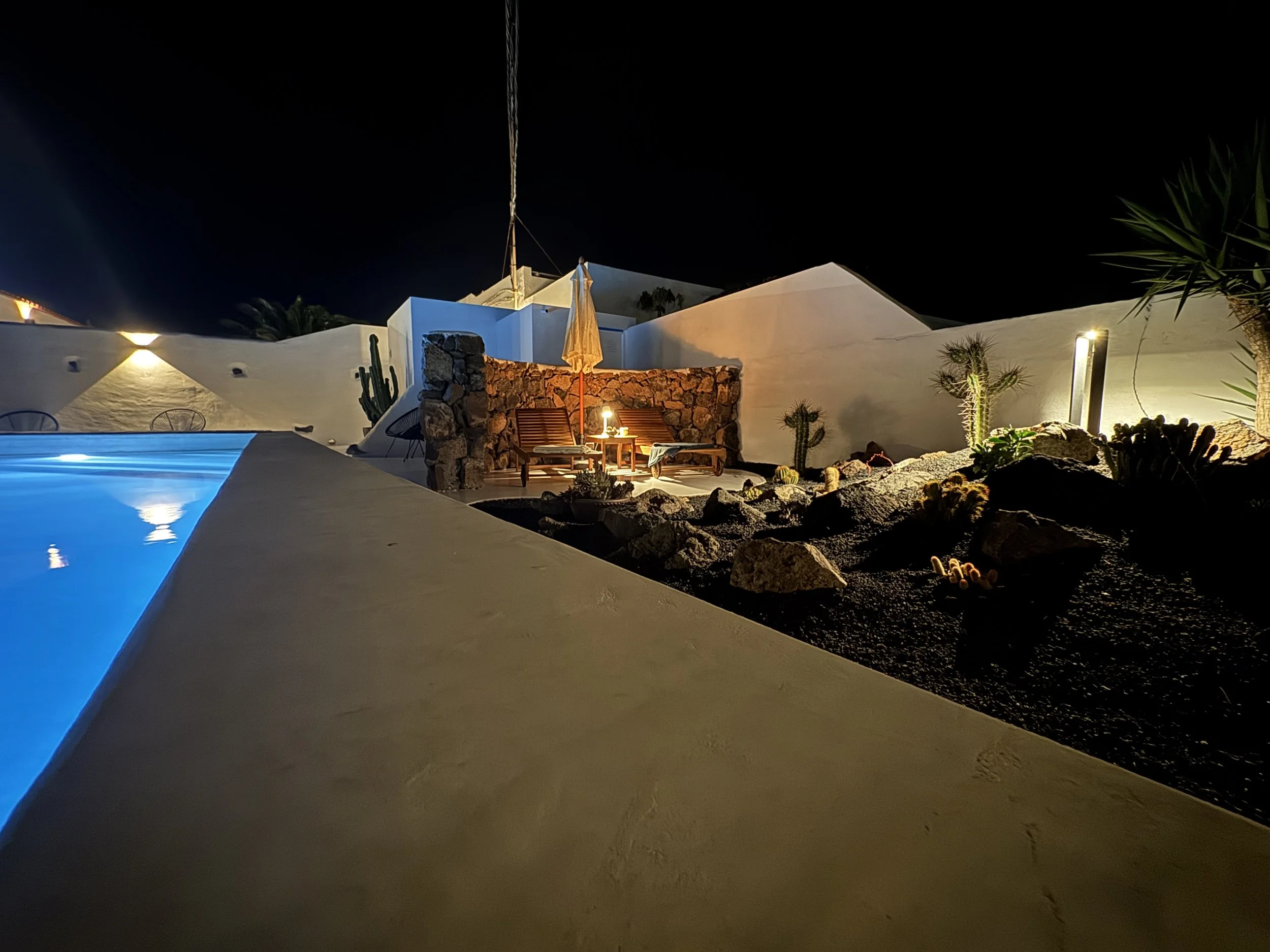 Illuminated swimming pool at night at Casitas Santa Rita Lanzarote