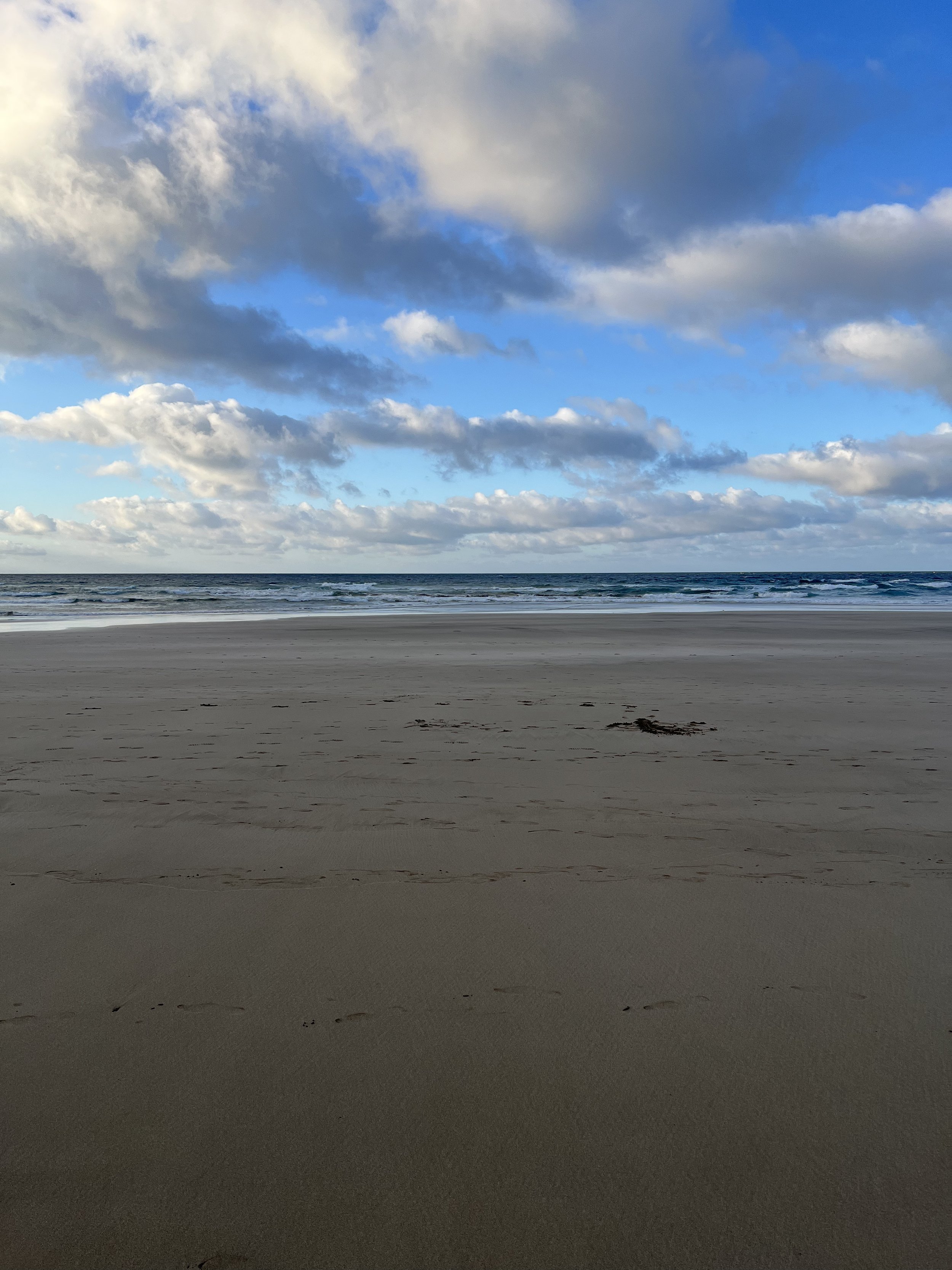 Wide beach at Playa de Las Canteras during an exceptionally low tide in Lanzarote.