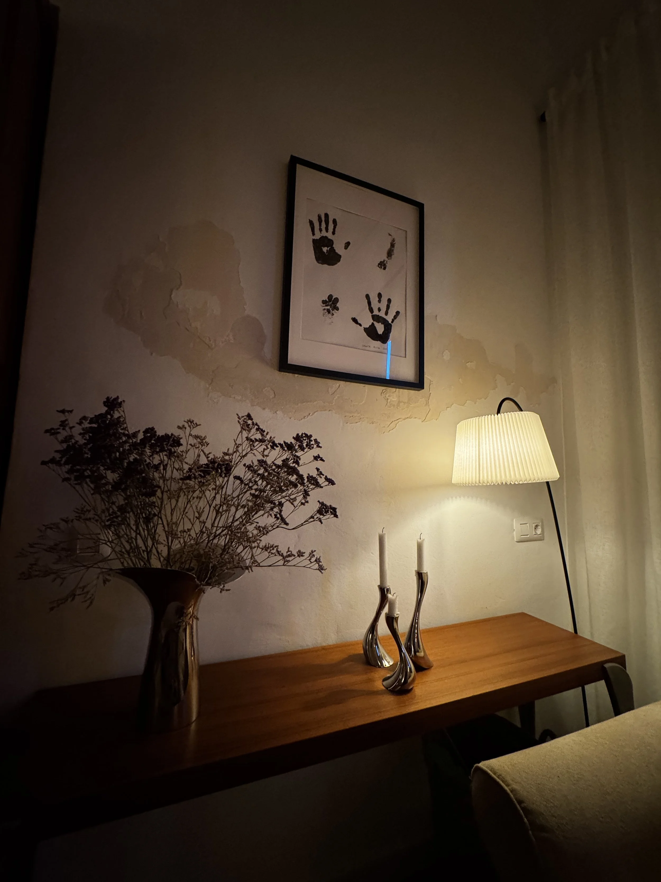 Warm evening light beside a naturally weathered interior wall in a Lanzarote home.