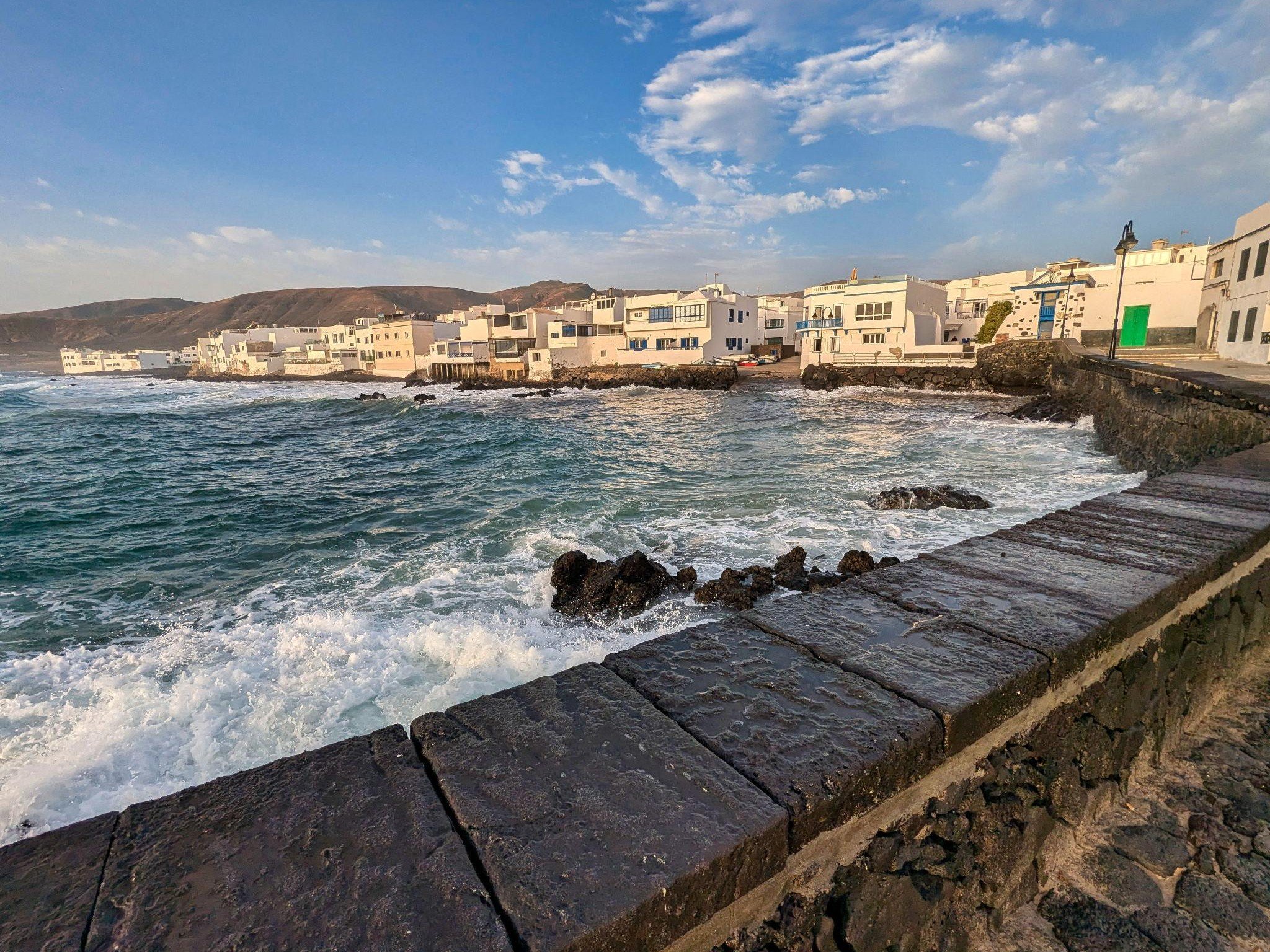Coastal village of Arrieta in North Lanzarote, an example of a quieter place where travellers can stay outside the main resorts.