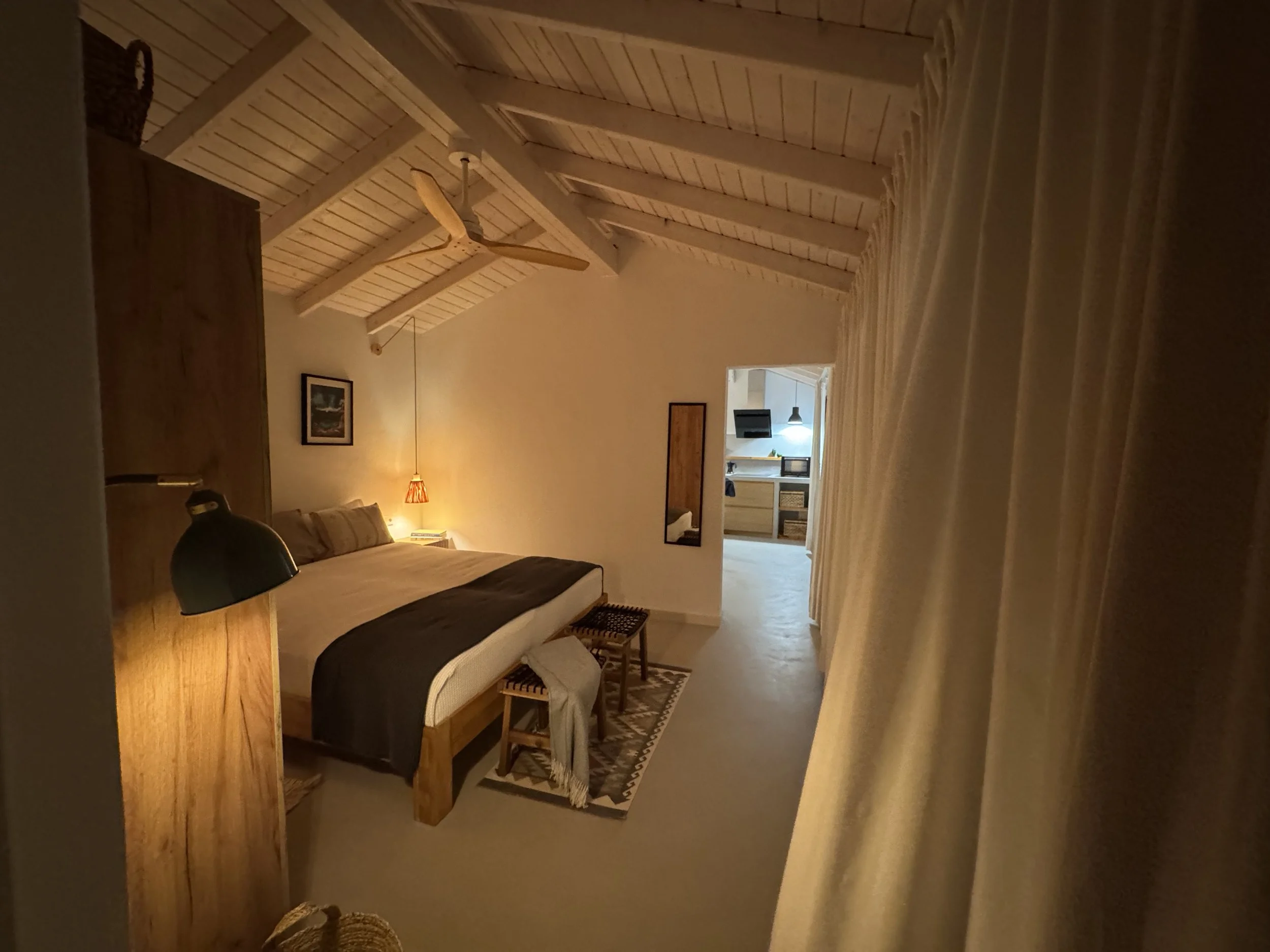 Cozy bedroom at Casita Coco Lanzarote in warm evening light