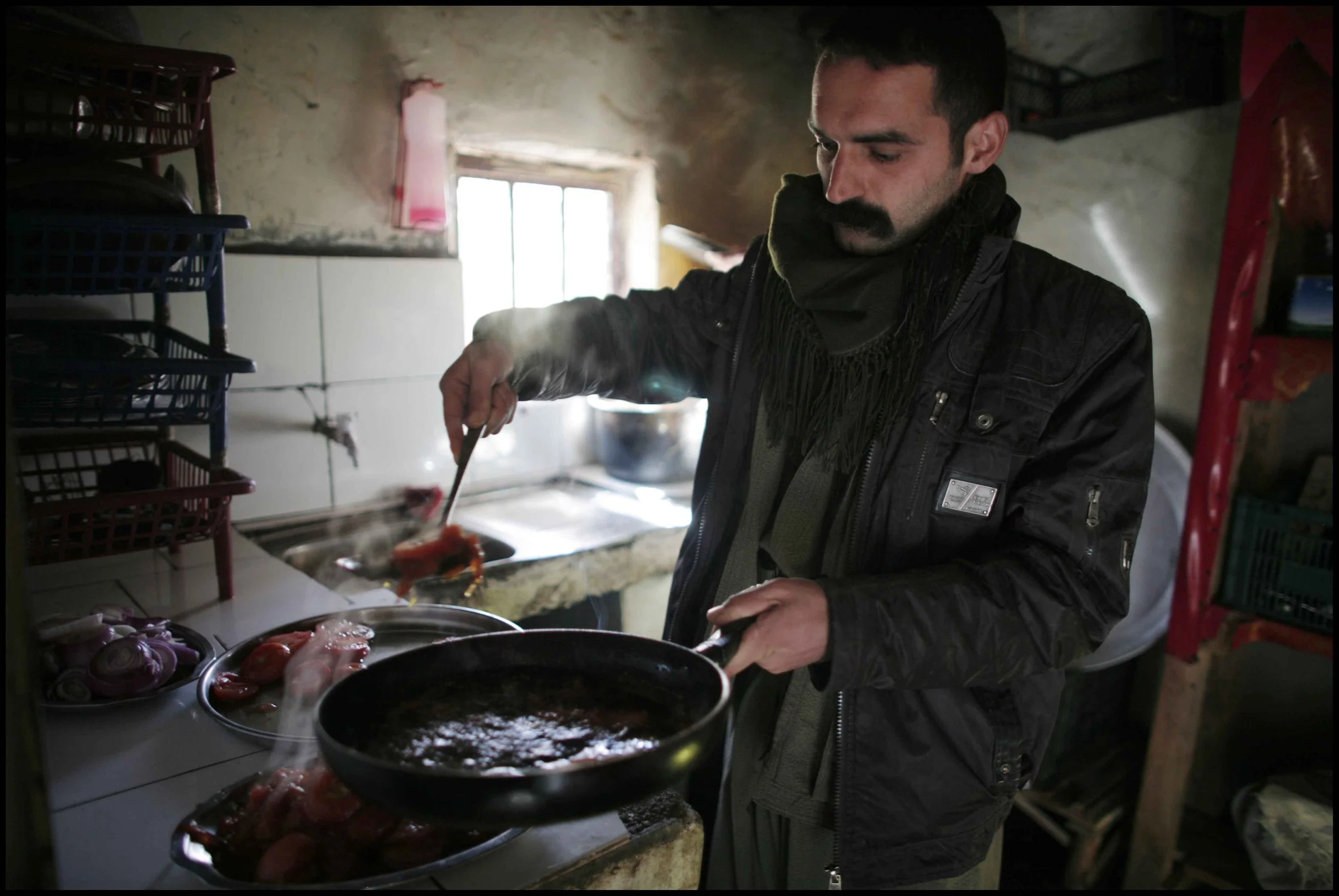 PJAK Qandil mountains, Kurdistan.
A control centre where the fighters are based during the day before heading for cover at night. Everyone is very proficient at cooking.
