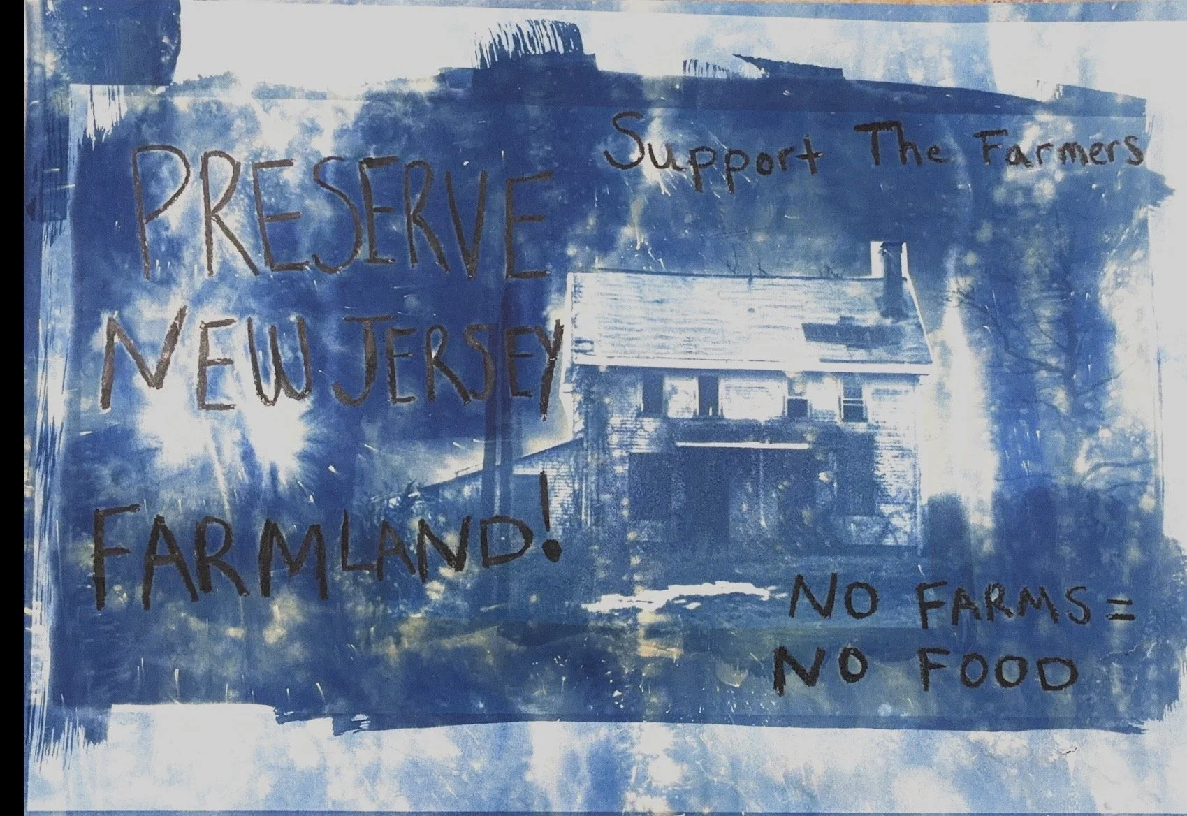 A sign with handwritten message supporting farmland preservation in New Jersey, stating 'Preserve New Jersey Farmland! Support The Farmers'.