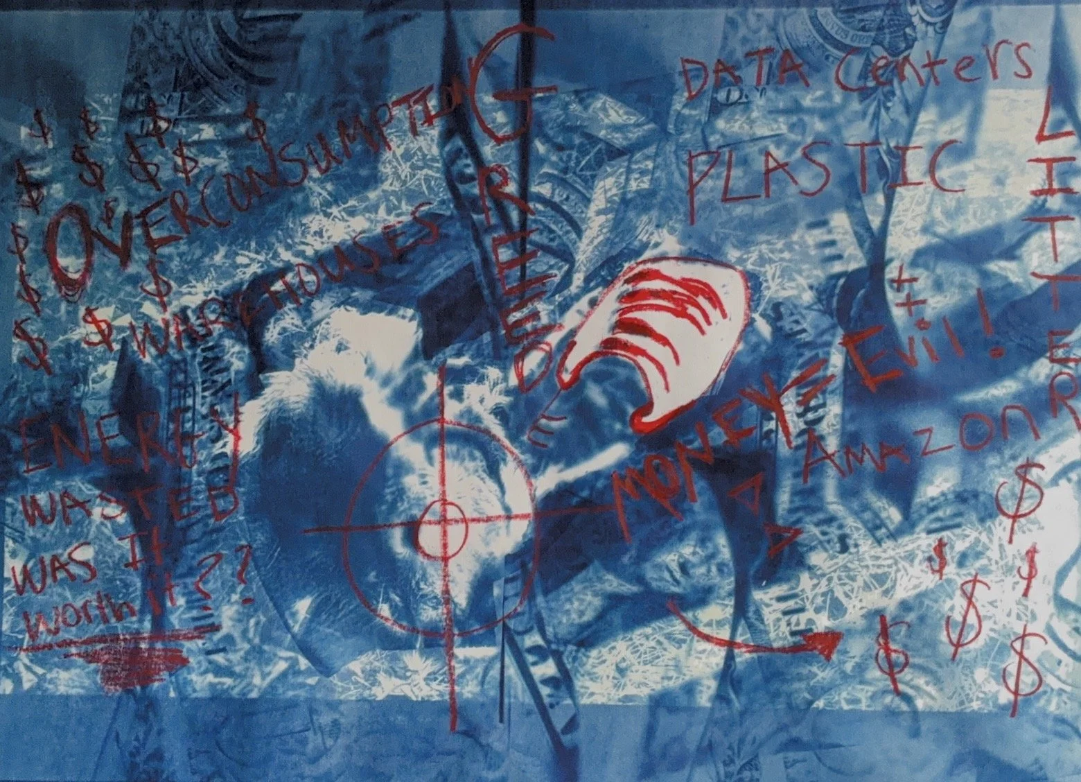 Overhead view of a person sitting on the ground with a rough, textured surface, surrounded by hand-drawn red markings, words, and symbols on a transparent plastic sheet. Items include a sneaker, a pen, and various annotations related to consumption and environmental issues.