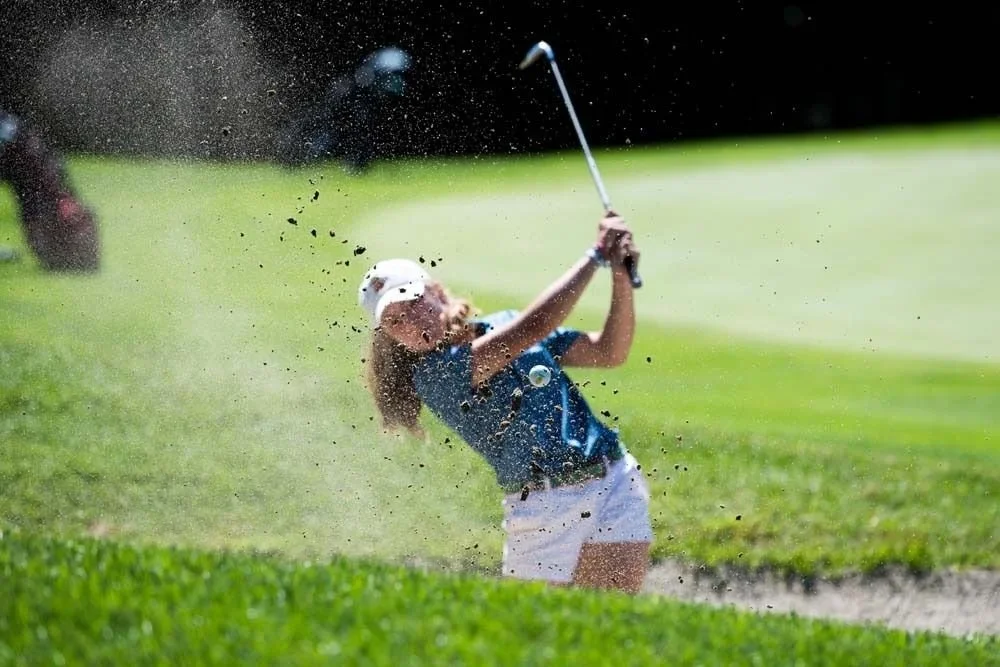Junior golfer hitting a drive at NEGTC