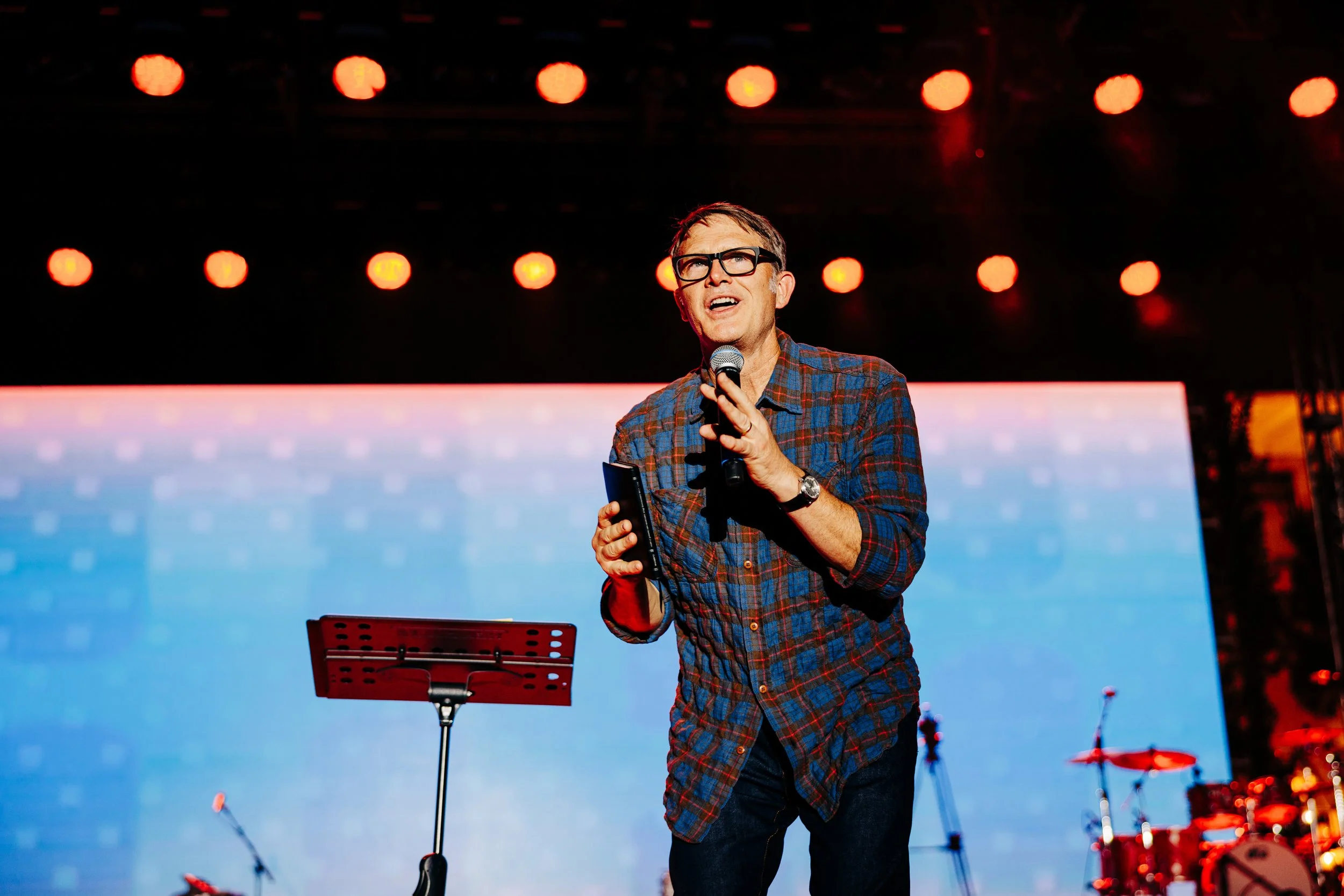 Andrew Palau speaking on stage