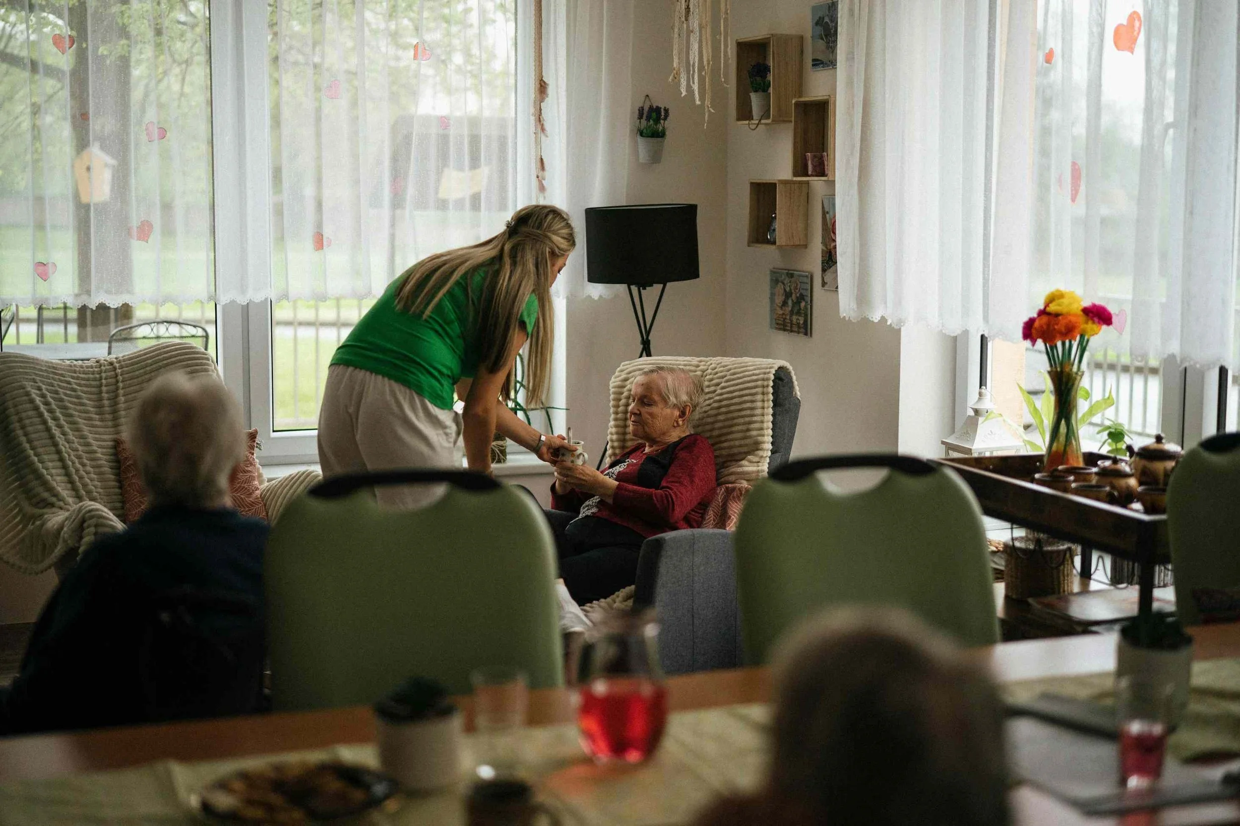 Older woman sitting comfortably in a relaxed home setting