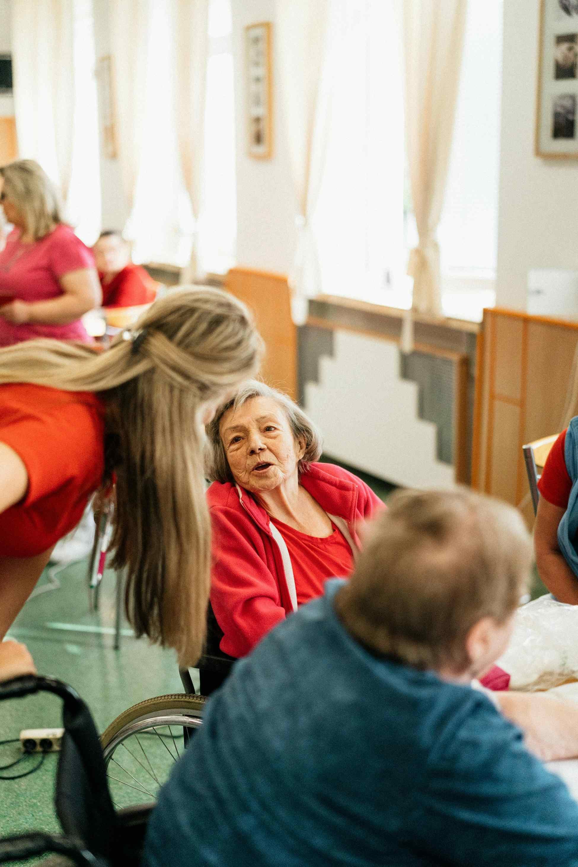 Seniors sharing a pleasant meal together at a dining table