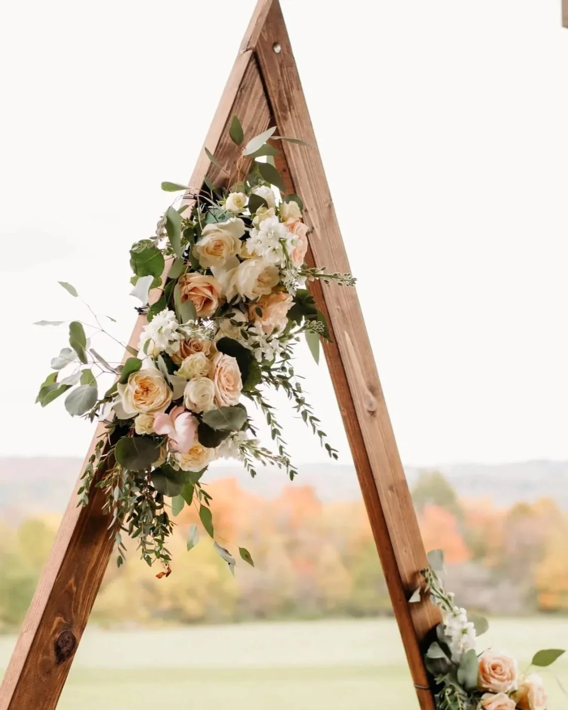 Wedding arbor floral arrangement.  Poppy’s Petals and Planning
