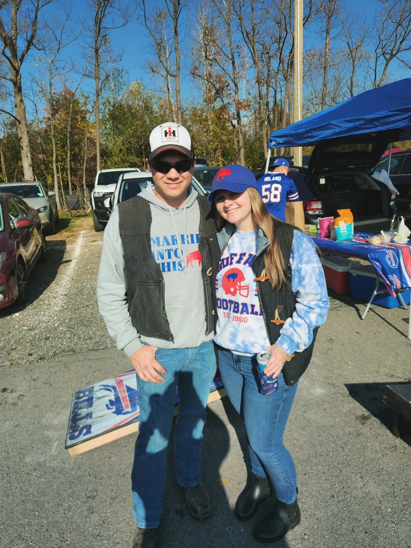 Rebecca, the founder of Poppy’s Petals and Planning in WNY and her husband enjoying the tailgate for a Buffalo Bills footballs game.
