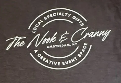 Logo for 'The Nook & Cranny', a local specialty gifts store in Amsterdam, NY, with a creative event space.