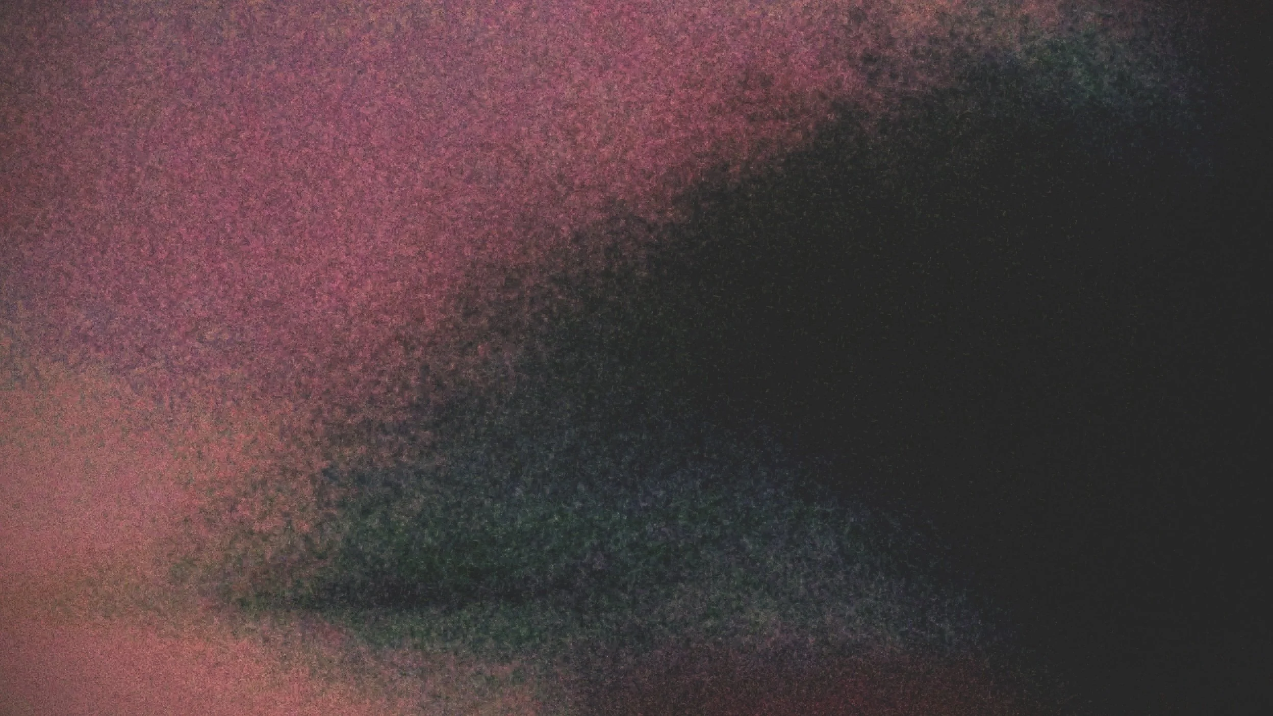 Abstract image with a gradient of colors from pink to dark gray and black, with a textured, blurry appearance.