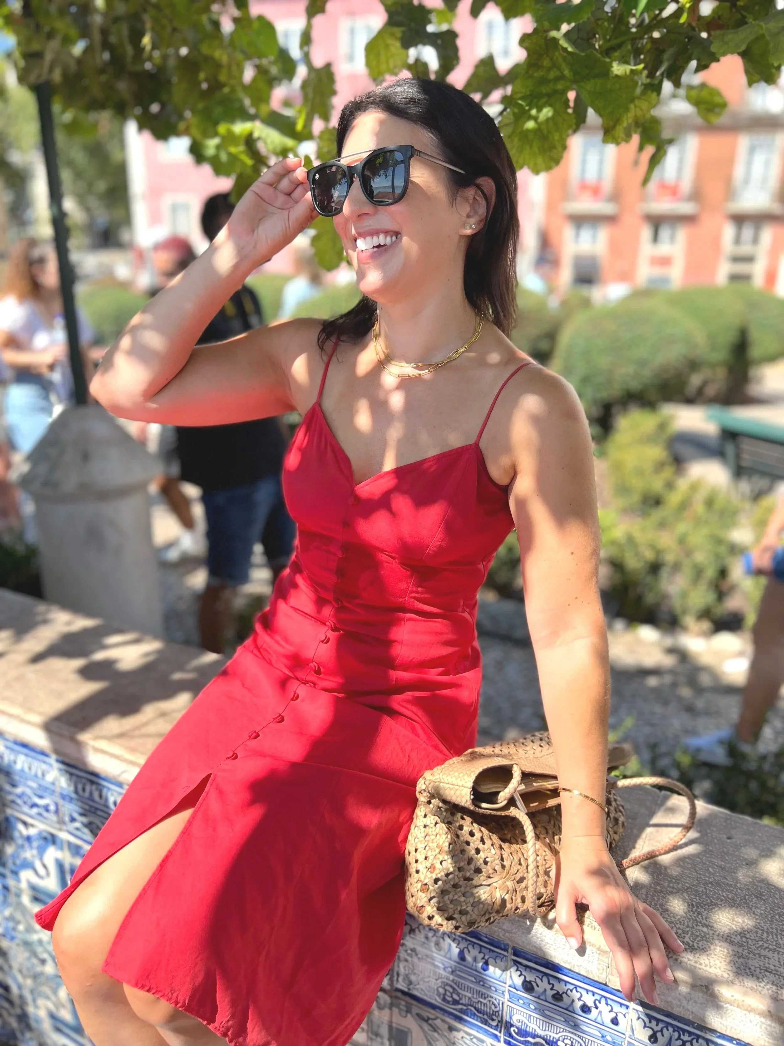 healthy Woman in a red dress sitting outdoors