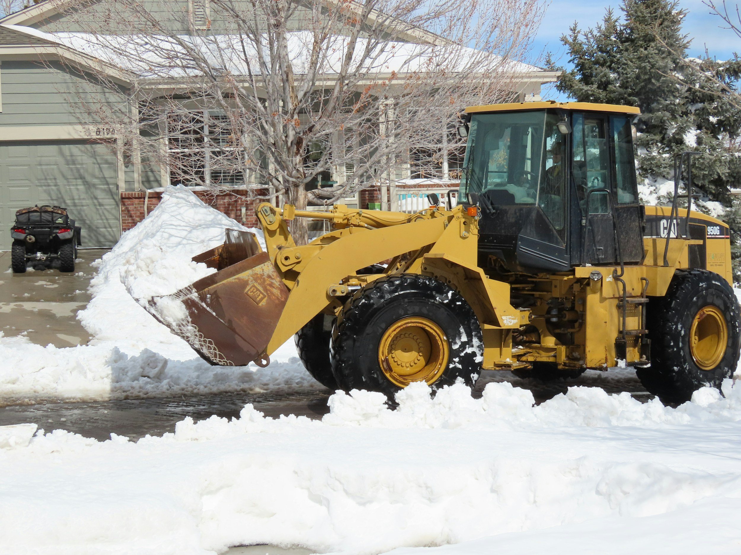 payloader with snow in the bucket