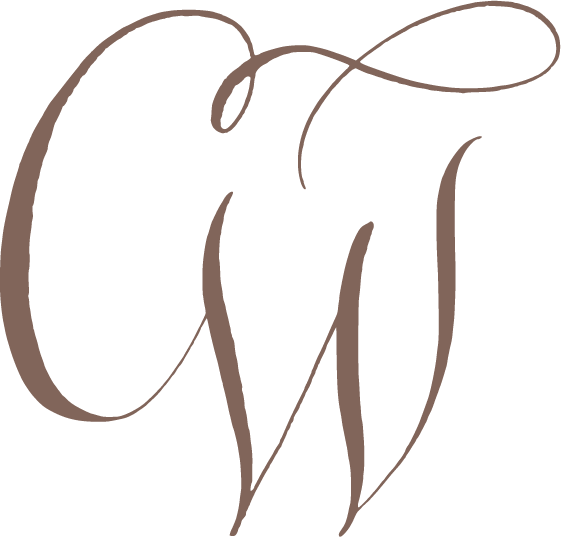 Close-up of a logo with stylized, cursive letters 'C' and 'M' intertwined in black and brown colors.
