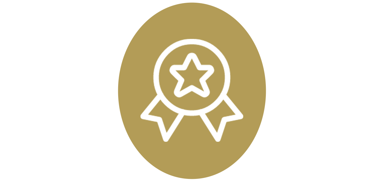 Gold award badge with a star inside a circle and ribbon tails.