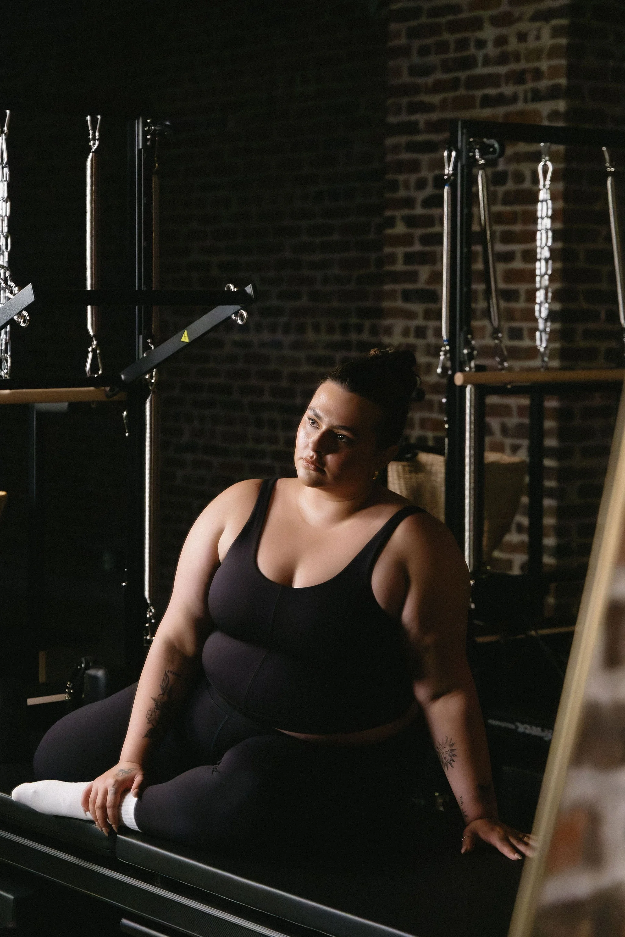 Woman on pilates reformer.