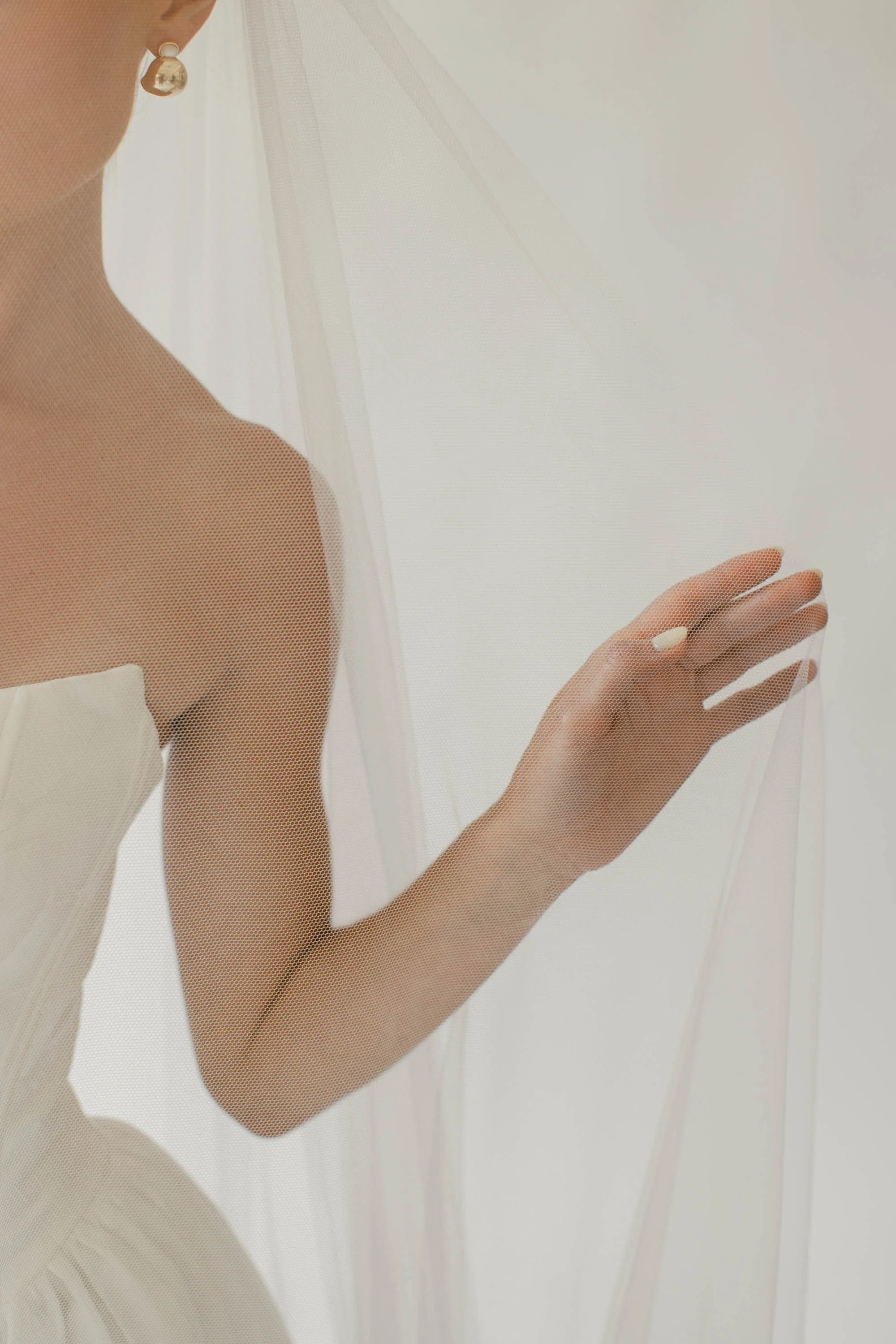 Woman in bridal veil.