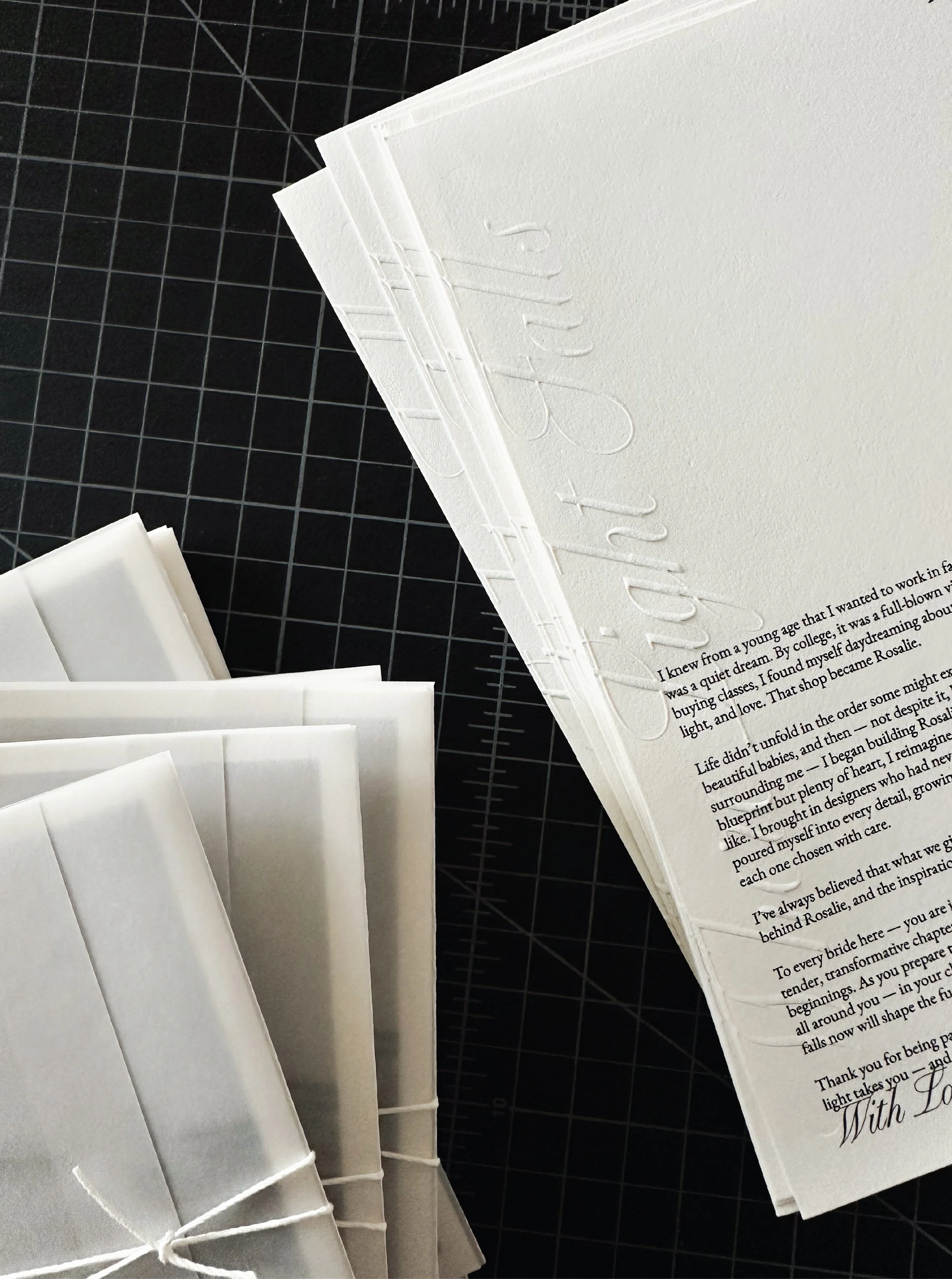 Embossed paper for bridal boutique.