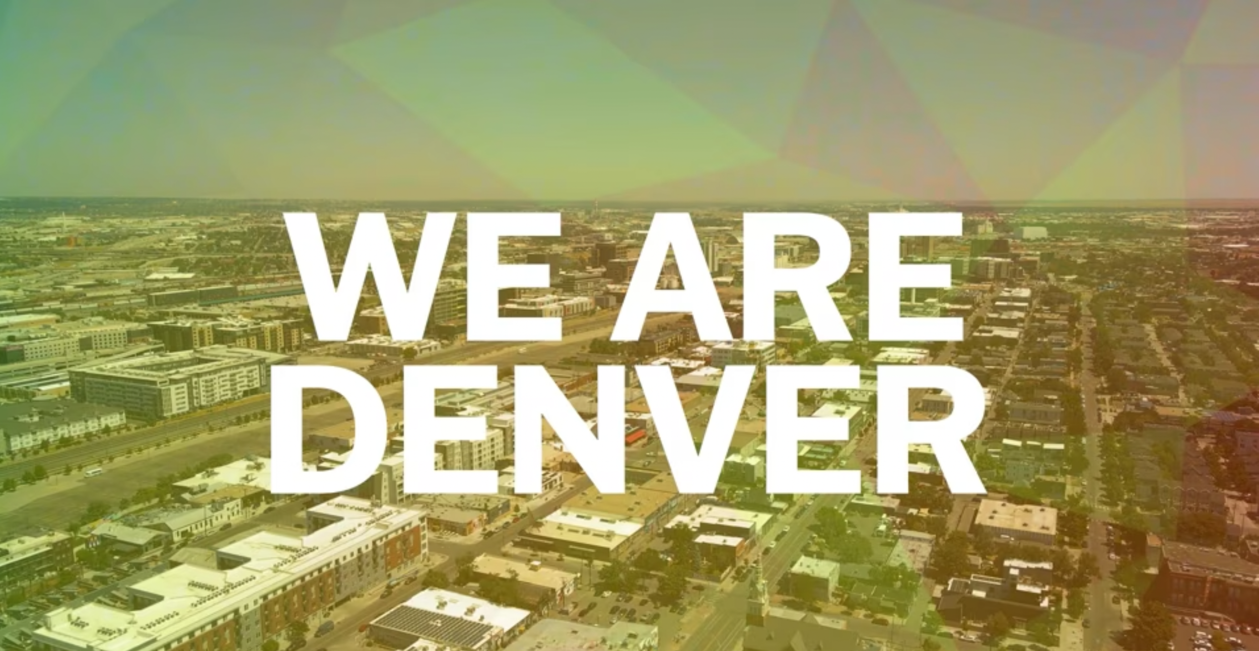 An aerial view of Denver cityscape with the words 'We Are Denver' in large white font overlaid.