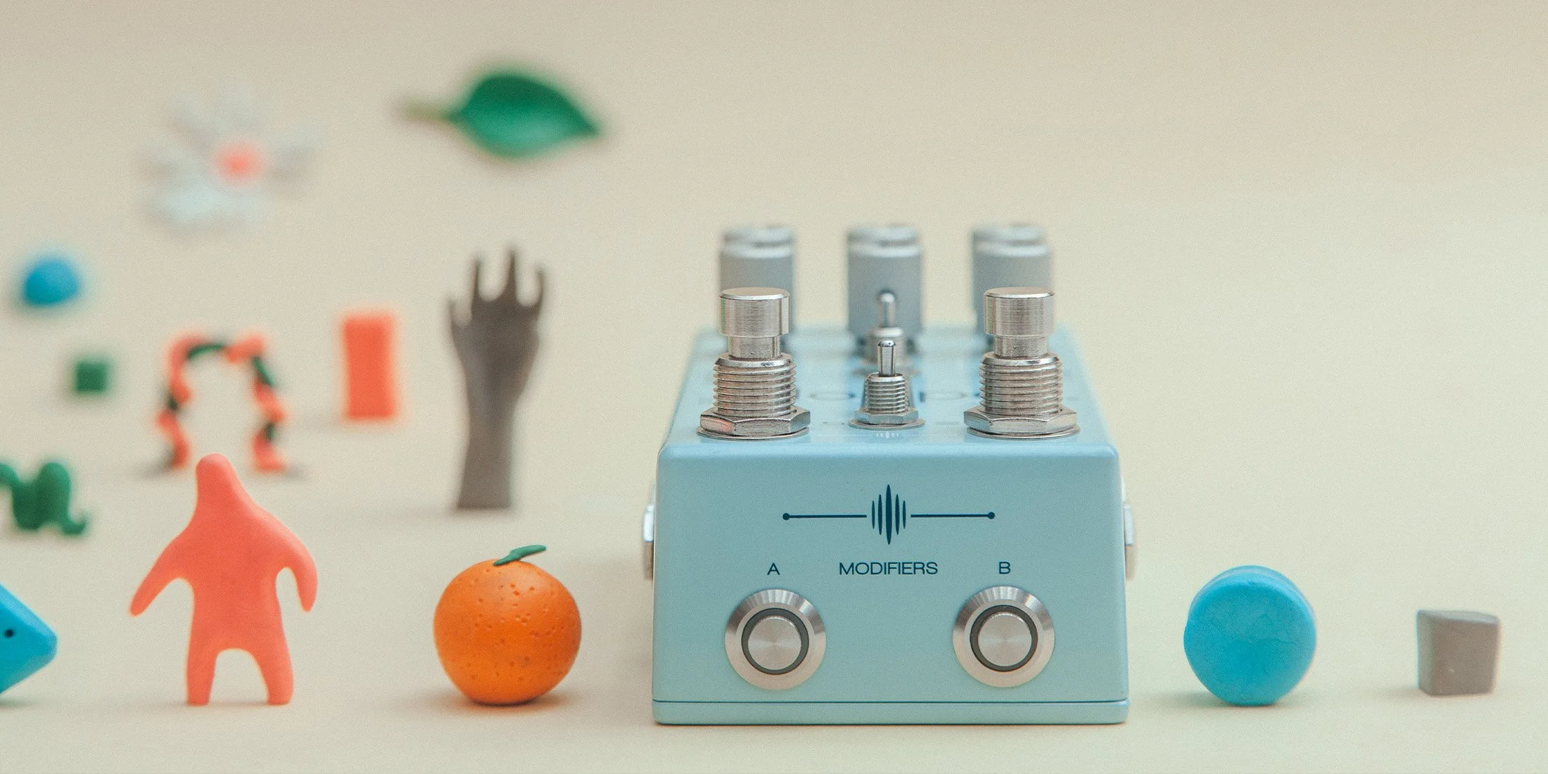 blooper effect pedal with little toys and trinkets.