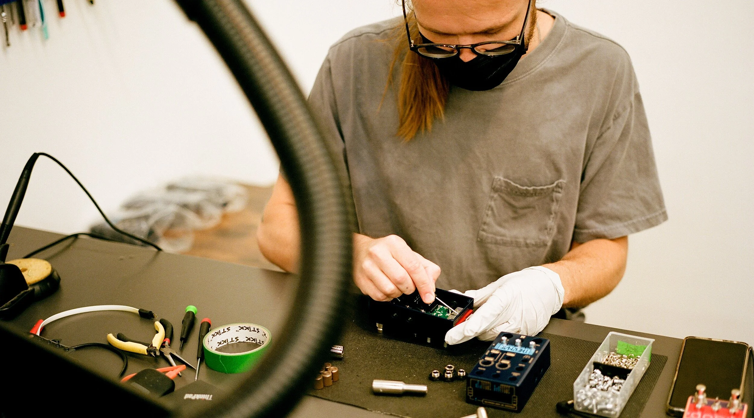 Person assembling a Thermae effects pedal.