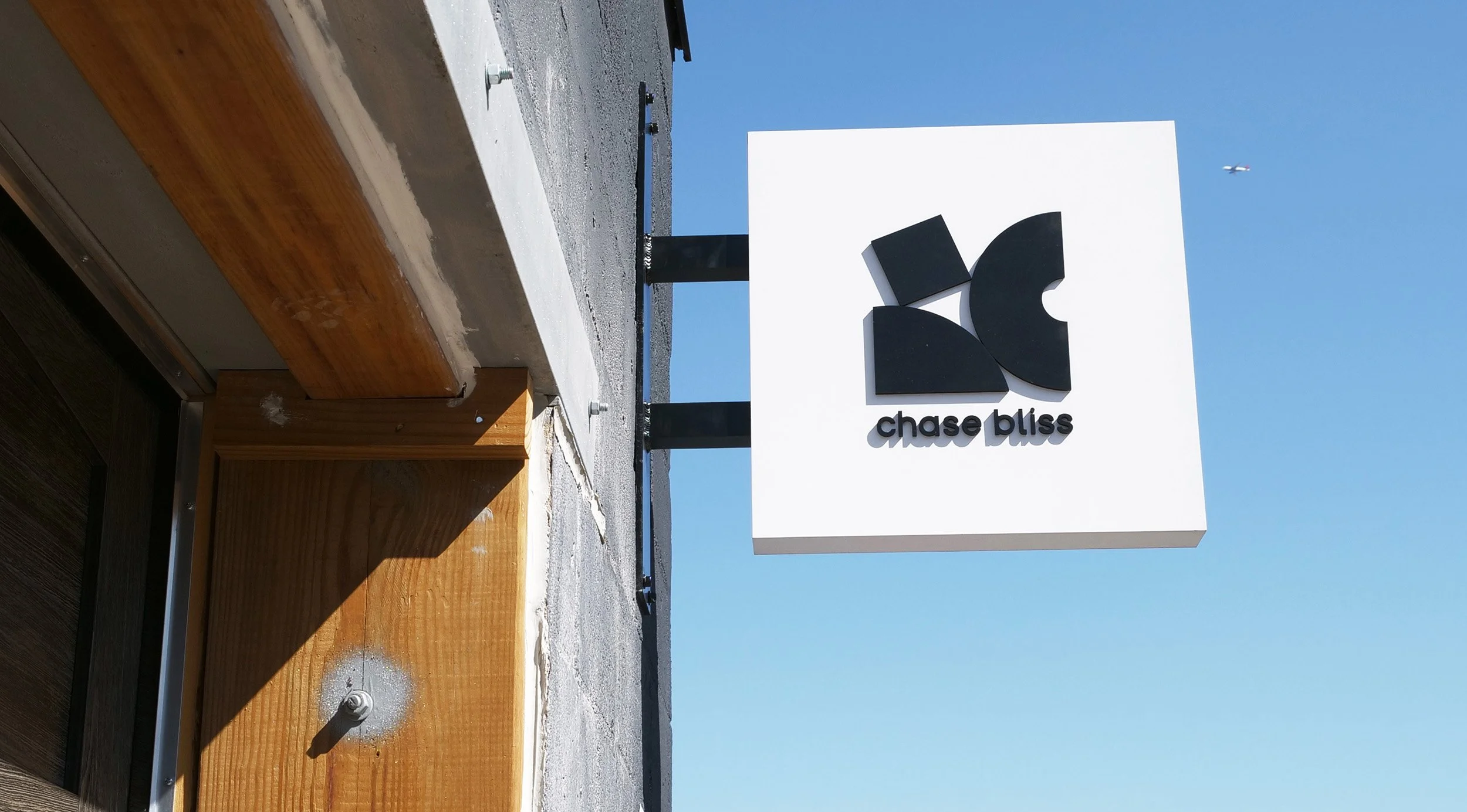 Exterior sign with the Chase Bliss logo.