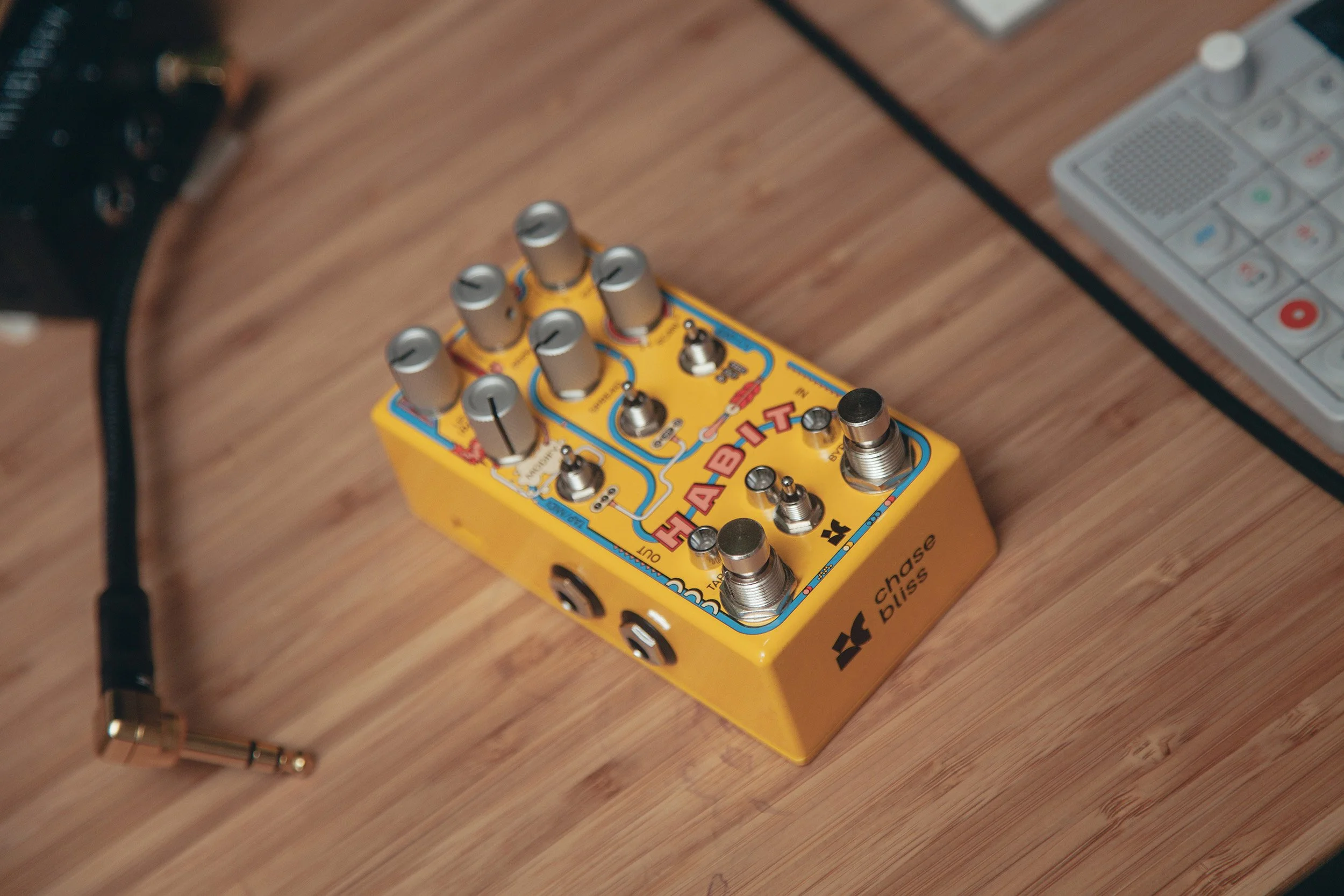 Habit pedal on a desk next to an OP-1.