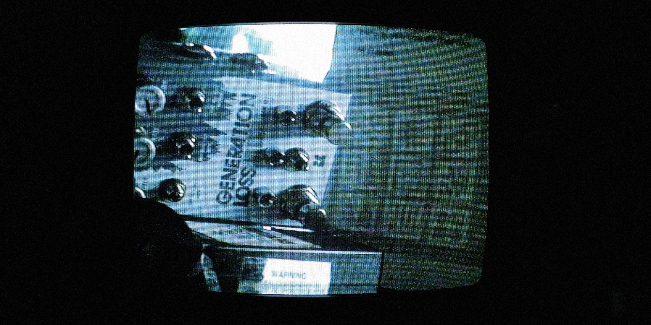 Grainy image of Generation Loss MKII pedal seen on an old CRTV.